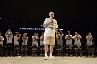 SAN ANTONIO, TX - JUNE 18:  Gregg Popovich of the San Antonio Spurs speaks to the crowd during the San Antonio Spurs NBA Championship Celebration on June 18, 2014 in the Alamodome in San Antonio, Texas. NOTE TO USER: User expressly acknowledges and agrees