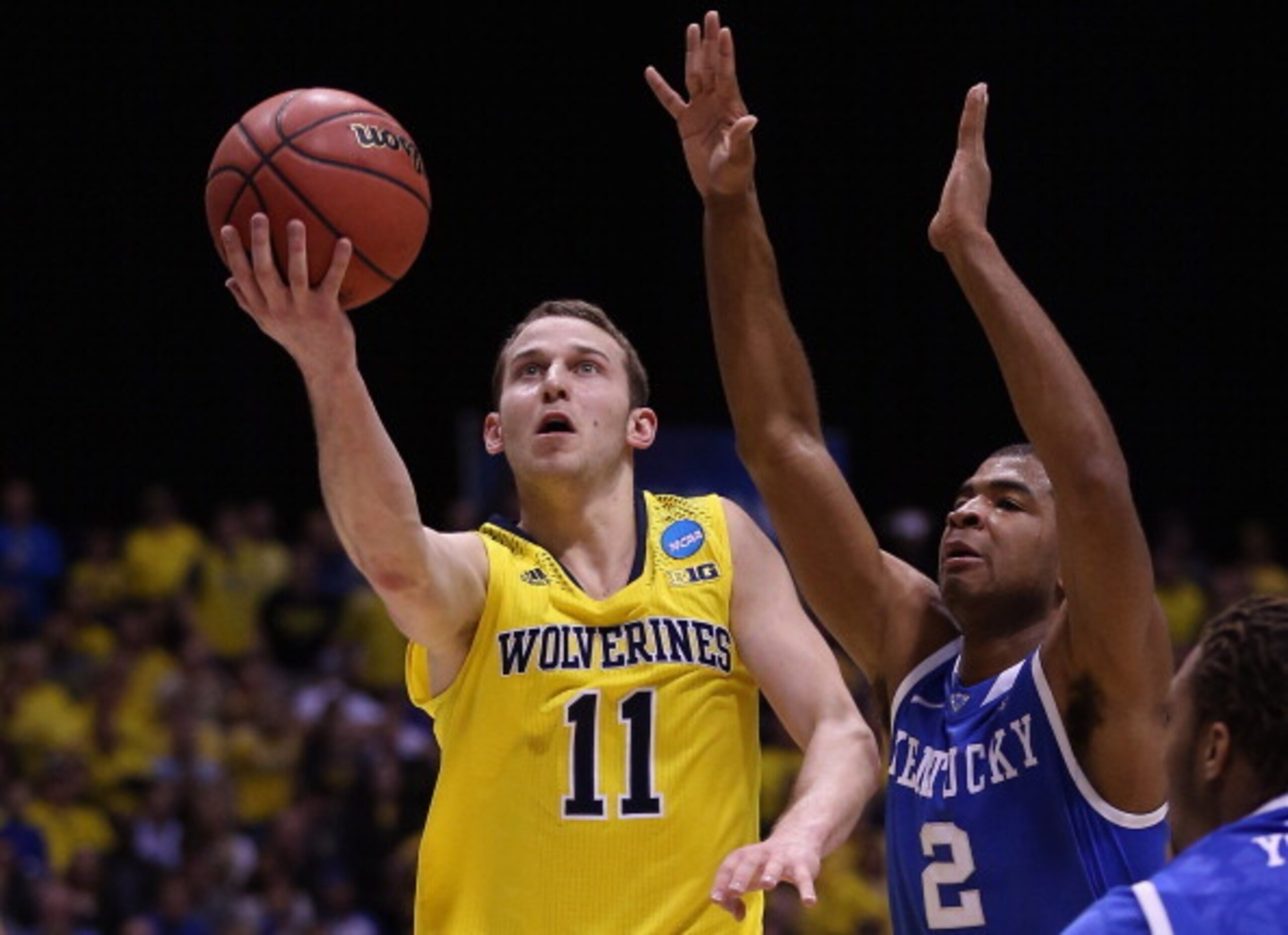 INDIANAPOLIS, IN - MARCH 30: Nik Stauskas #11 of the Michigan Wolverines shoots the ball against Aaron Harrison #2 of the Kentucky Wildcats during the midwest regional final of the 2014 NCAA Men's Basketball Tournament at Lucas Oil Stadium on March 30, 2 INDIANAPOLIS, IN - MARCH 30: Nik Stauskas #11 of the Michigan Wolverines shoots the ball against Aaron Harrison #2 of the Kentucky Wildcats during the midwest regional final of the 2014 NCAA Men's Basketball Tournament at Lucas Oil Stadium on March 30, 2