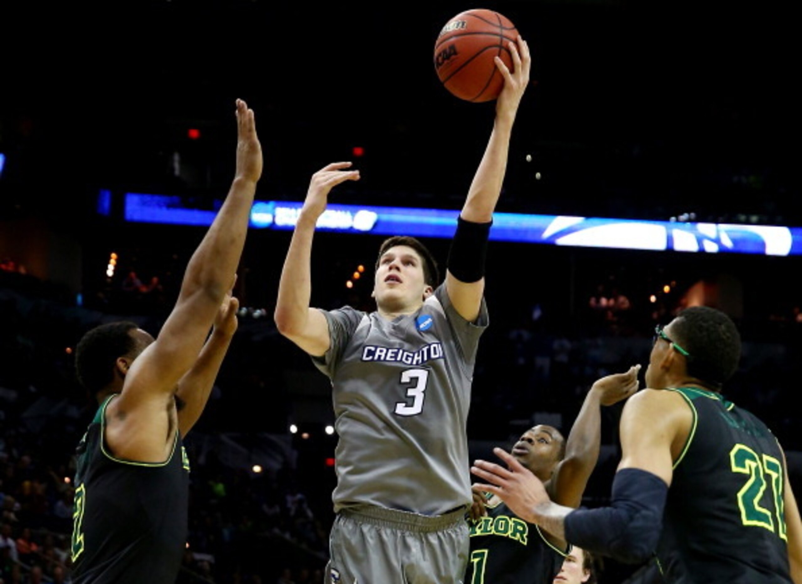 SAN ANTONIO, TX - MARCH 23: Doug McDermott #3 of the Creighton Bluejays takes a shot as Rico Gathers #2 and Isaiah Austin #21 of the Baylor Bears defend during the third round of the 2014 NCAA Men's Basketball Tournament at the AT&T Center on March 23, 2 SAN ANTONIO, TX - MARCH 23: Doug McDermott #3 of the Creighton Bluejays takes a shot as Rico Gathers #2 and Isaiah Austin #21 of the Baylor Bears defend during the third round of the 2014 NCAA Men's Basketball Tournament at the AT&T Center on March 23, 2