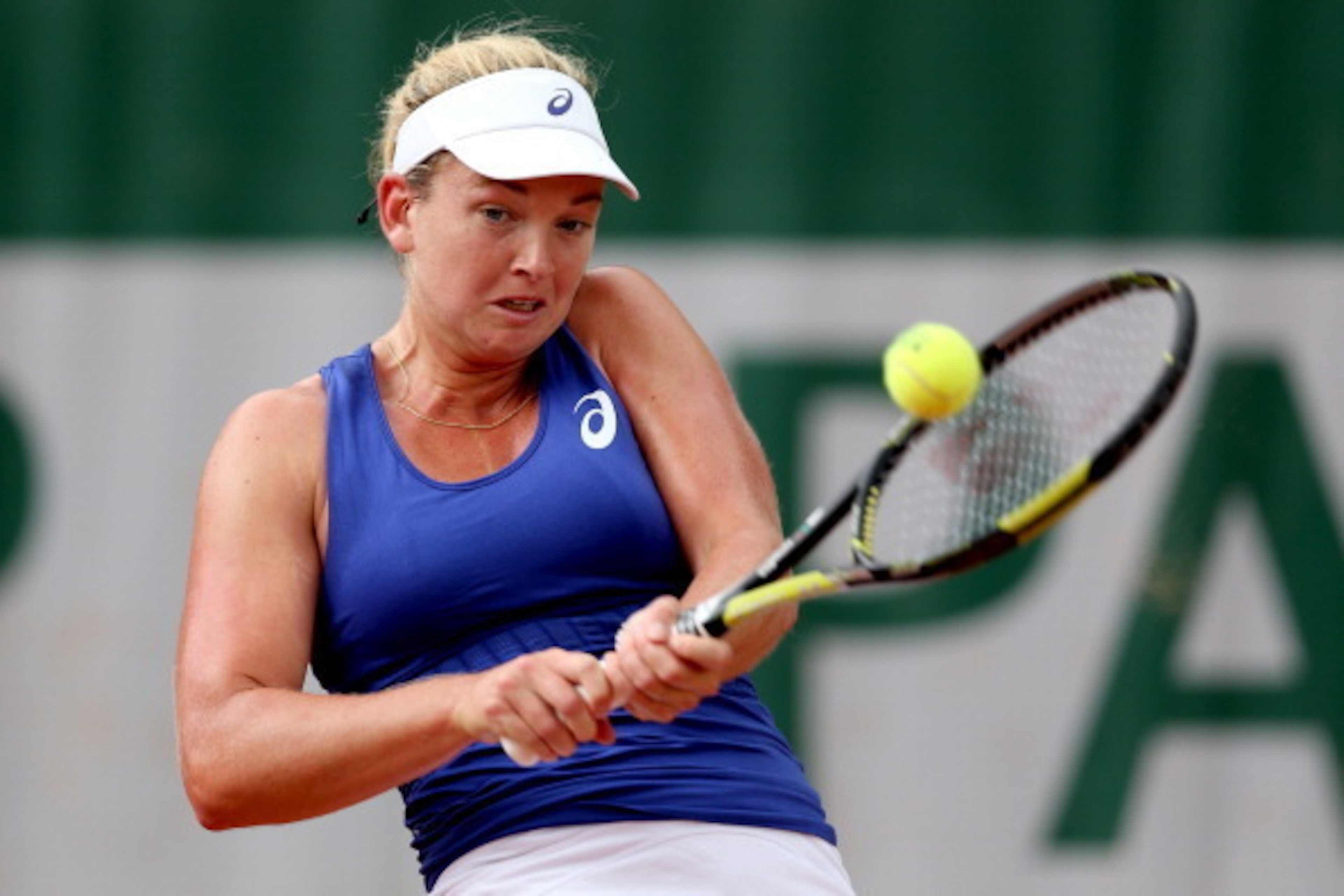 PARIS, FRANCE - MAY 29:  Coco Vandeweghe of the United States returns a shot during her women's singles match against Ekaterina Makarova of Russia on day five of the French Open at Roland Garros on May 29, 2014 in Paris, France.  (Photo by Matthew Stockma