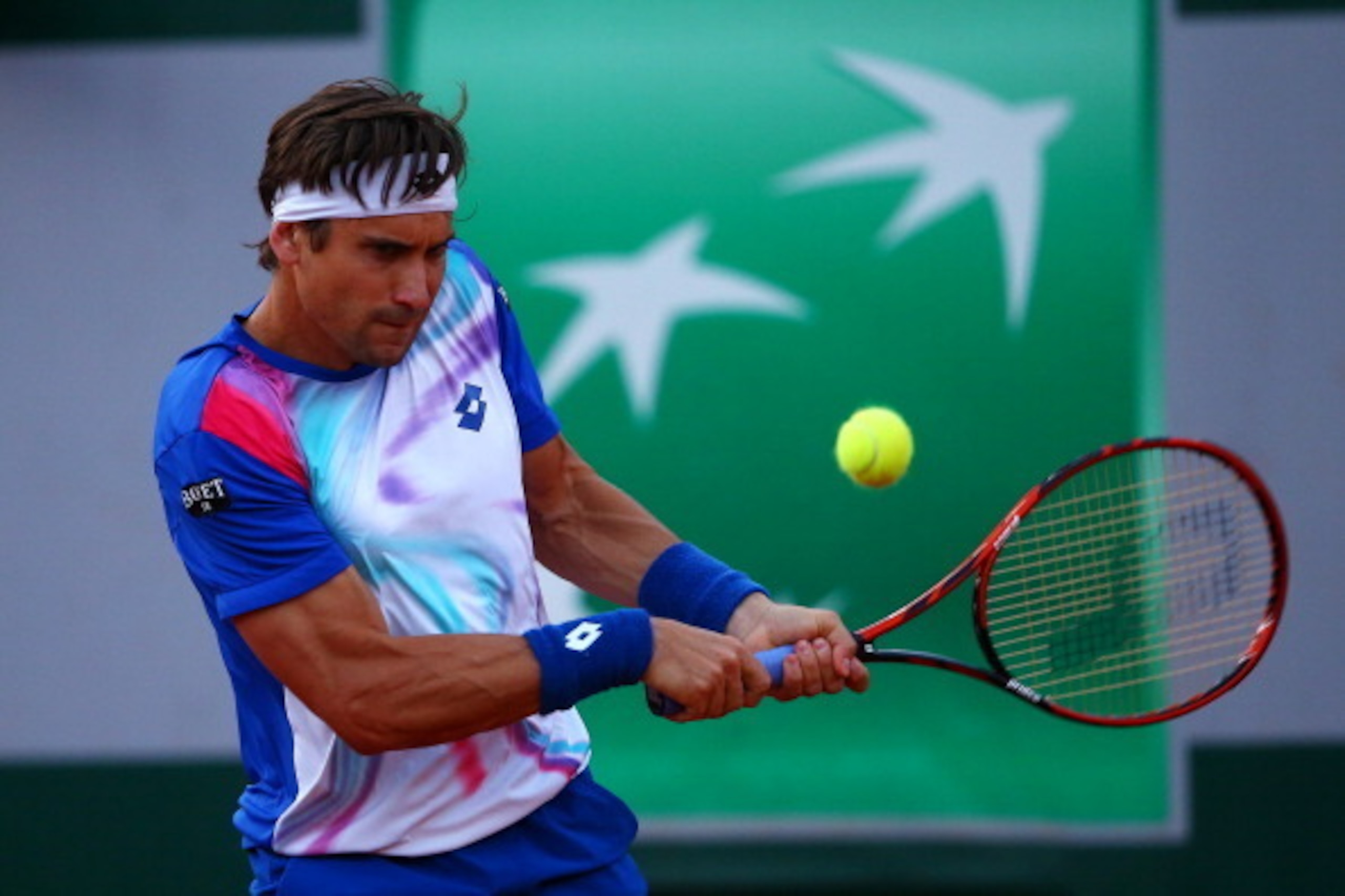 PARIS, FRANCE - JUNE 04:  David Ferrer of Spain returns a shot during his men's singles match against Rafael Nadal of Spain on day eleven of the French Open at Roland Garros on June 4, 2014 in Paris, France.  (Photo by Dan Istitene/Getty Images)