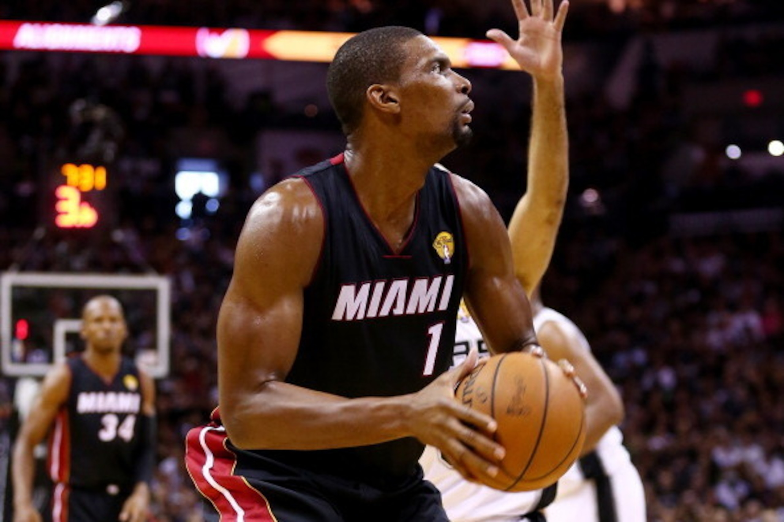 SAN ANTONIO, TX - JUNE 15: Chris Bosh #1 of the Miami Heat looks to shoot against the San Antonio Spurs during Game Five of the 2014 NBA Finals at the AT&T Center on June 15, 2014 in San Antonio, Texas. NOTE TO USER: User expressly acknowledges and agrees