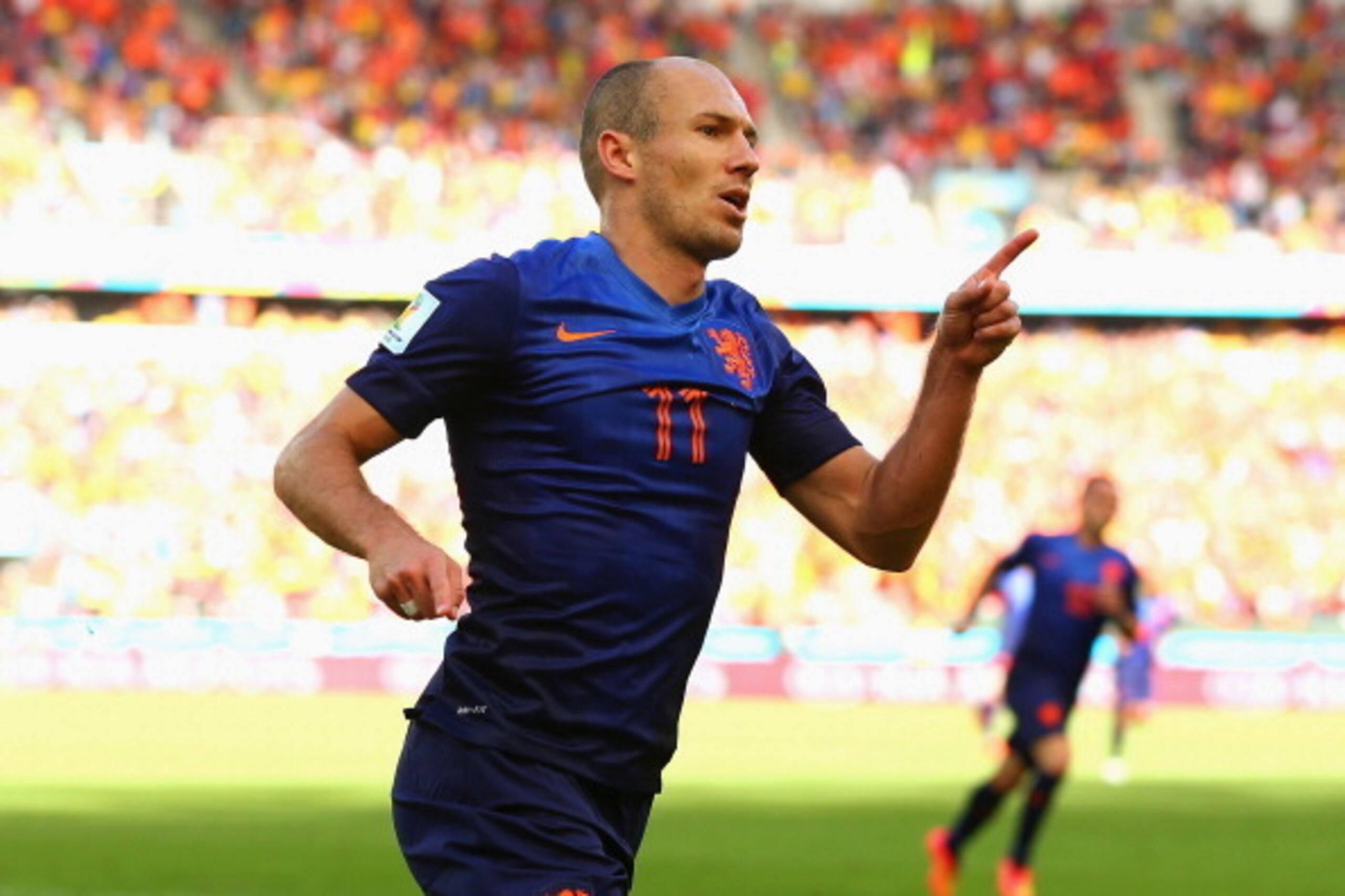 PORTO ALEGRE, BRAZIL - JUNE 18:  Arjen Robben of the Netherlands celebrates after scoring his team's first goal during the 2014 FIFA World Cup Brazil Group B match between Australia and Netherlands at Estadio Beira-Rio on June 18, 2014 in Porto Alegre, Br