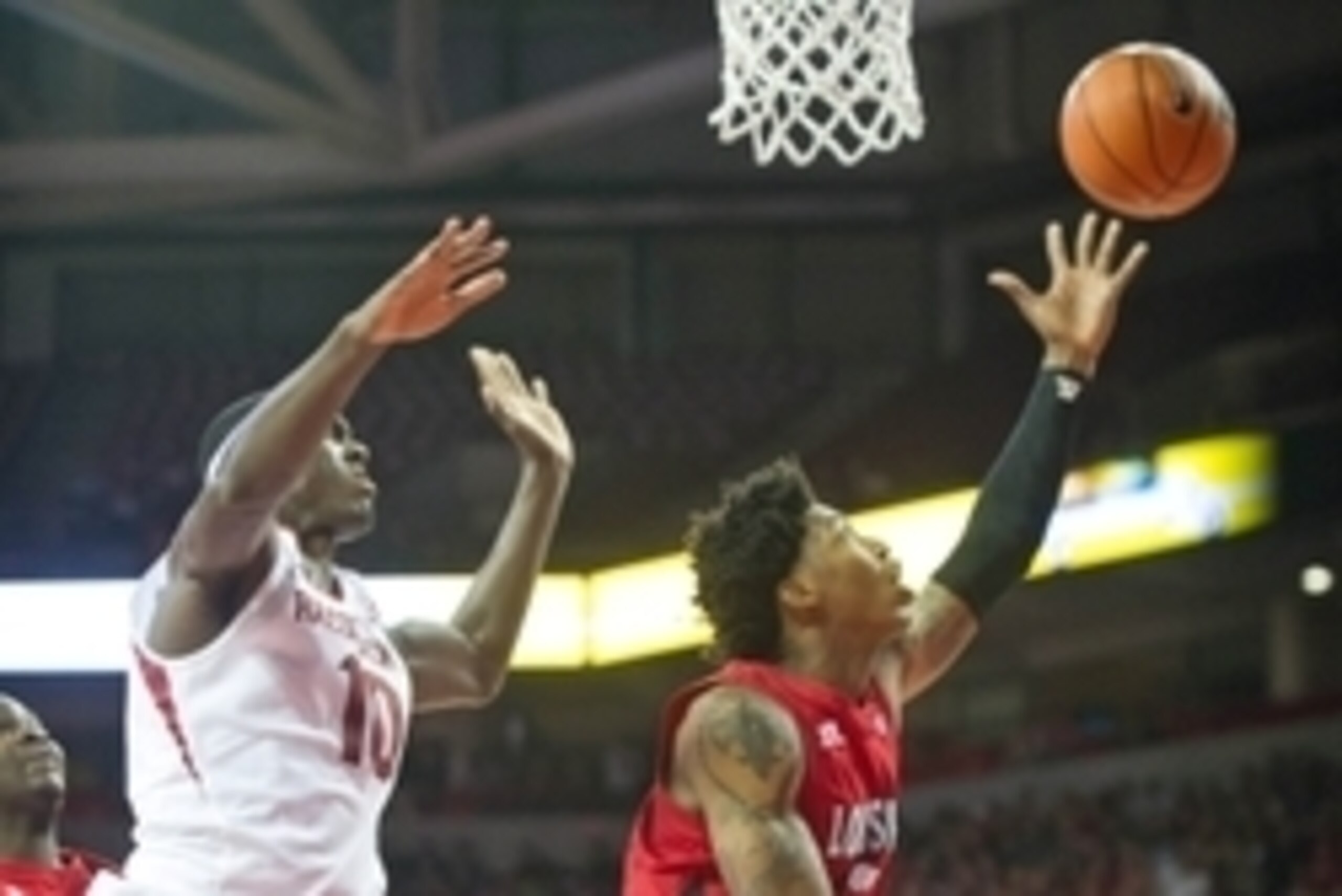 Nov 15, 2013; Fayetteville, Ar, USA; Louisiana-Lafayette Ragin' Cajuns guard Elfrid Payton (2) drives to the basket past Arkansas Razorbacks forward Bobby Portis (10) during a game  at Bud Walton Arena Arena. Arkansas defeated Louisiana-Lafayette 76-63.  