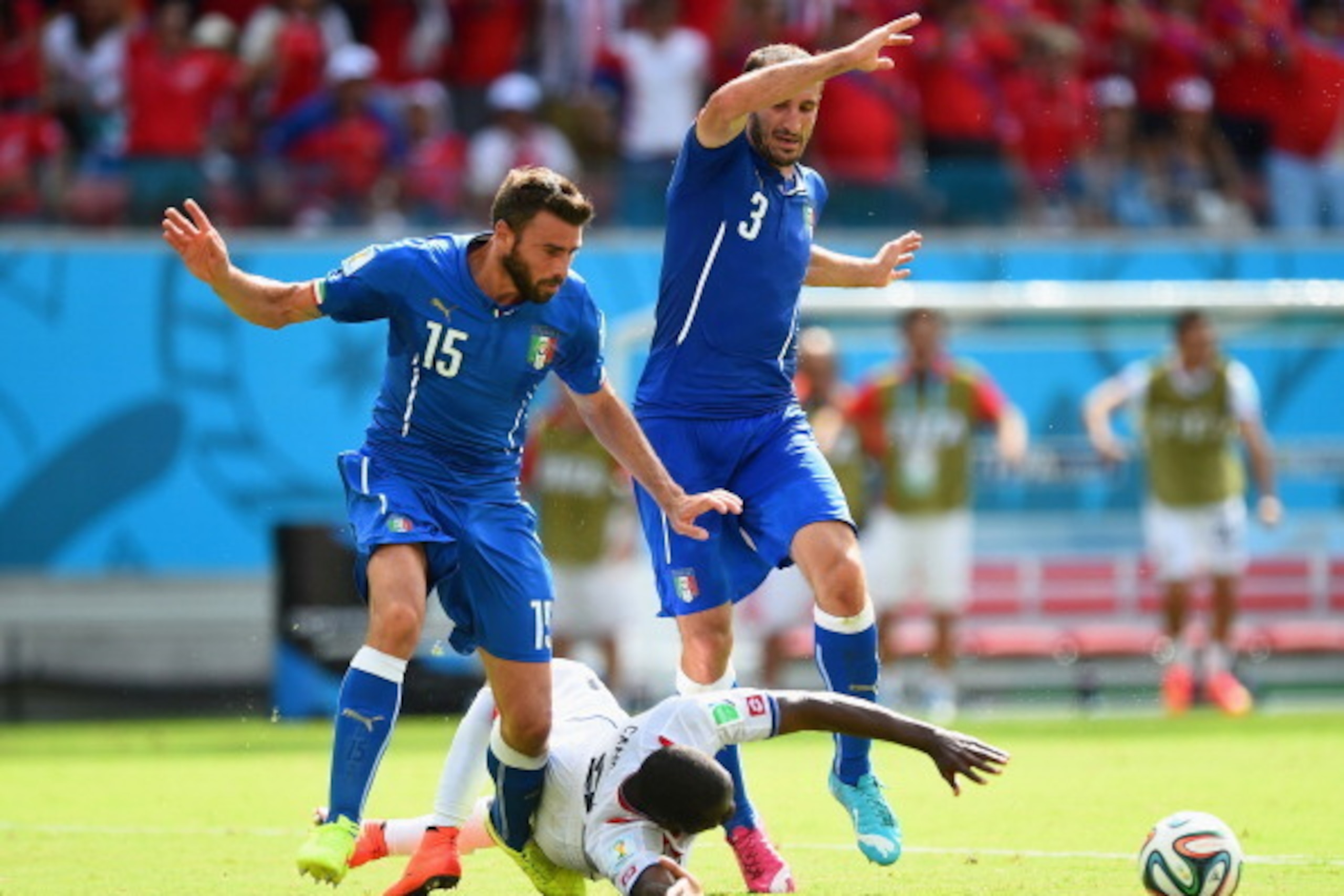 RECIFE, BRAZIL - JUNE 20:  Joel Campbell of Costa Rica falls after a challenge by Giorgio Chiellini (L) and Andrea Barzagli of Italy during the 2014 FIFA World Cup Brazil Group D match between Italy and Costa Rica at Arena Pernambuco on June 20, 2014 in R
