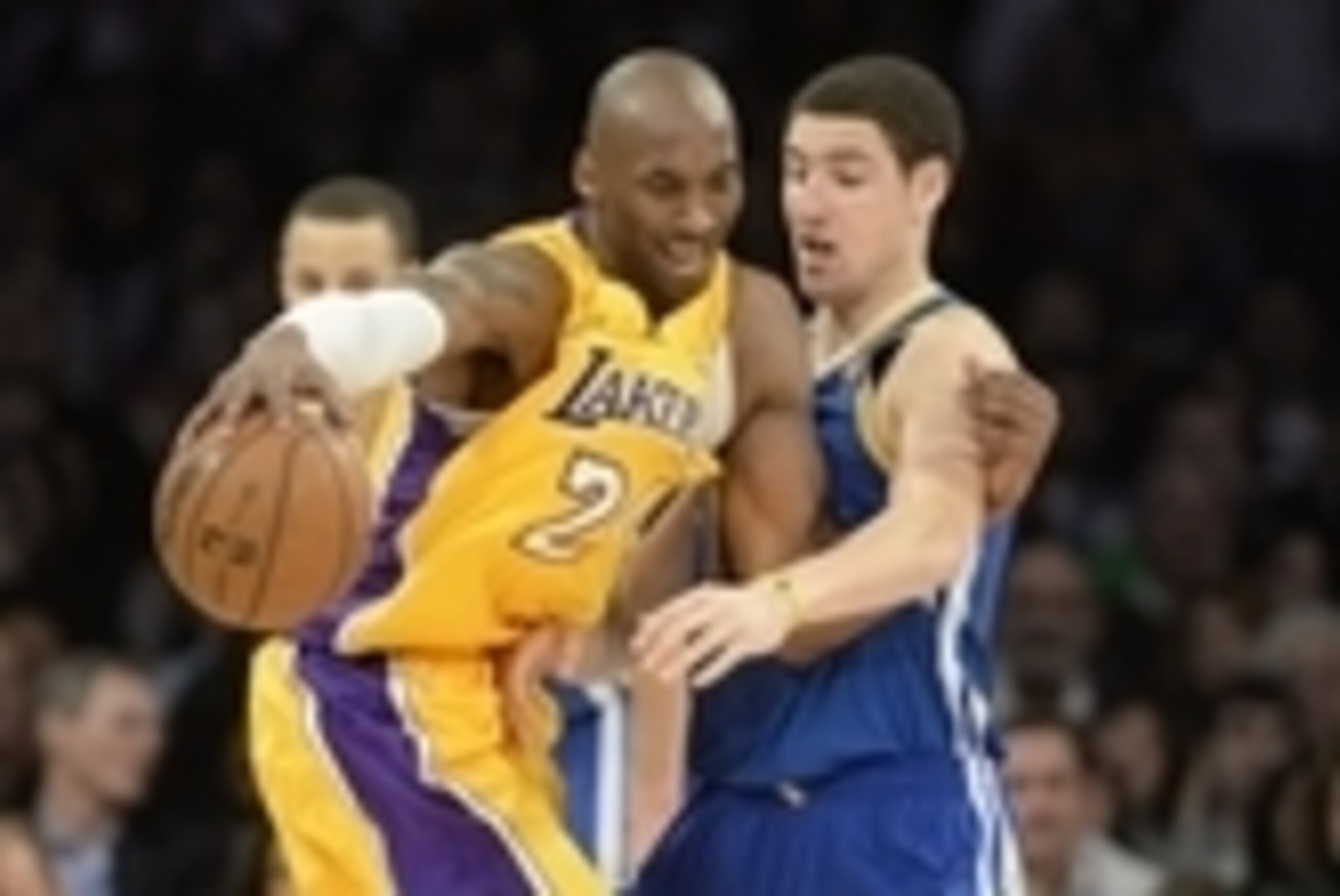 Apr 12, 2013; Los Angeles, CA, USA; Los Angeles Lakers shooting guard Kobe Bryant (24) dribbles against Golden State Warriors shooting guard Klay Thompson (11) during the game at Staples Center. Mandatory Credit: Richard Mackson-USA TODAY Sports