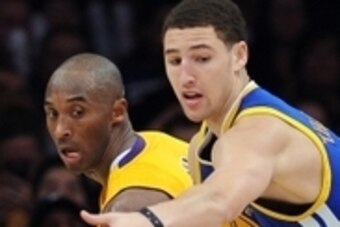November 9, 2012; Los Angeles, CA, USA;  Los Angeles Lakers shooting guard Kobe Bryant (24) guards Golden State Warriors shooting guard Klay Thompson (11) in the second half at the Staples Center. Lakers won 101-77.Mandatory Credit: Jayne Kamin-Oncea-USA 
