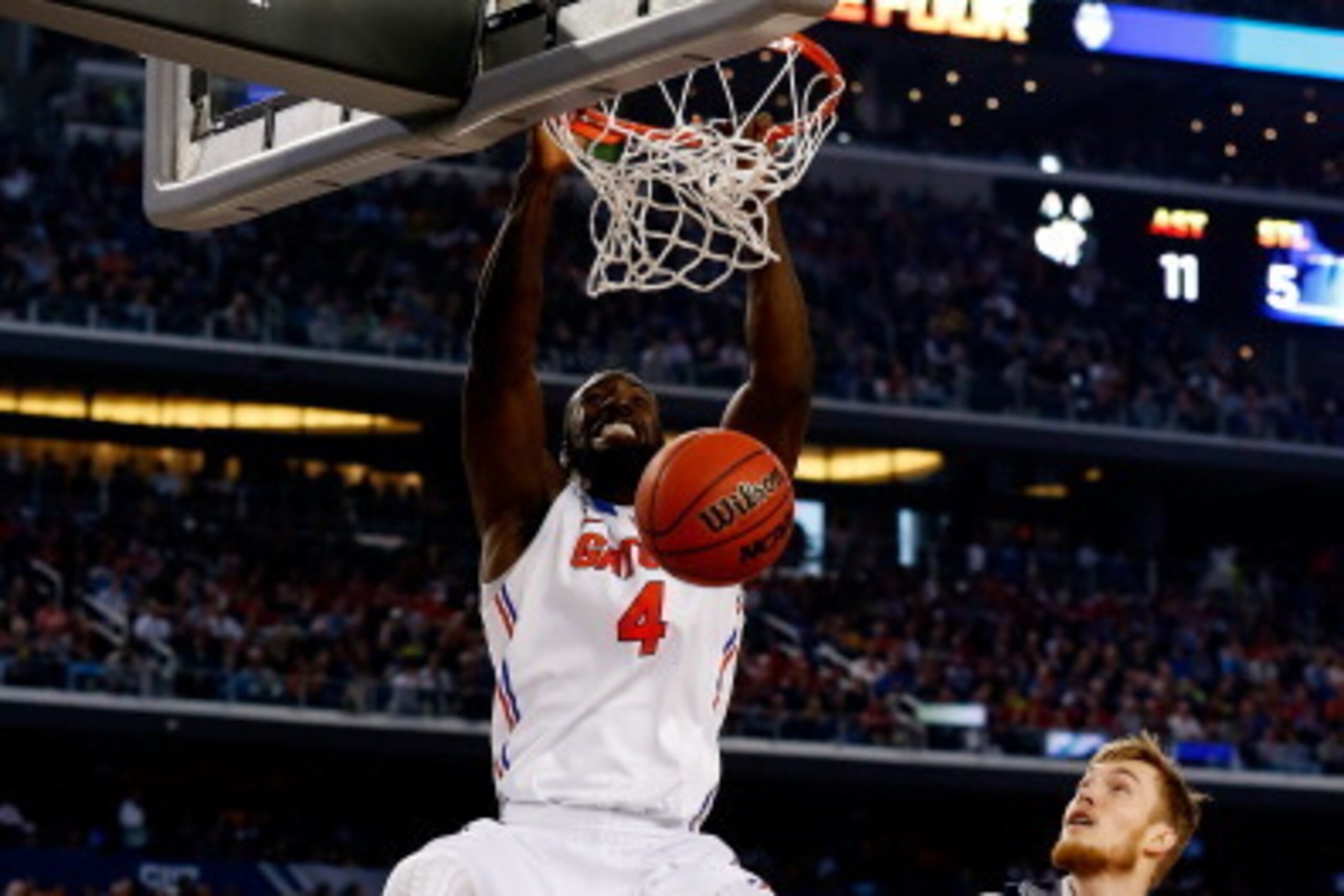 ARLINGTON, TX - APRIL 05:  Patric Young #4 of the Florida Gators dunks against the Connecticut Huskies during the NCAA Men's Final Four Semifinal at AT&T Stadium on April 5, 2014 in Arlington, Texas.  (Photo by Tom Pennington/Getty Images)