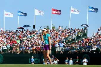 PINEHURST, NC - JUNE 22:  Michelle Wie of the United States celebrates her two shot victory during the final round of the 69th U.S. Women's Open at Pinehurst Resort & Country Club, Course No. 2 on June 22, 2014 in Pinehurst, North Carolina.  (Photo by Str