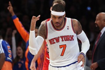 NEW YORK, NY - DECEMBER 11:  Carmelo Anthony #7 of the New York Knicks celebrates a three pointer in the second quarter against the Chicago Bulls at Madison Square Garden on December 11, 2013 in New York City. NOTE TO USER: User expressly acknowledges and