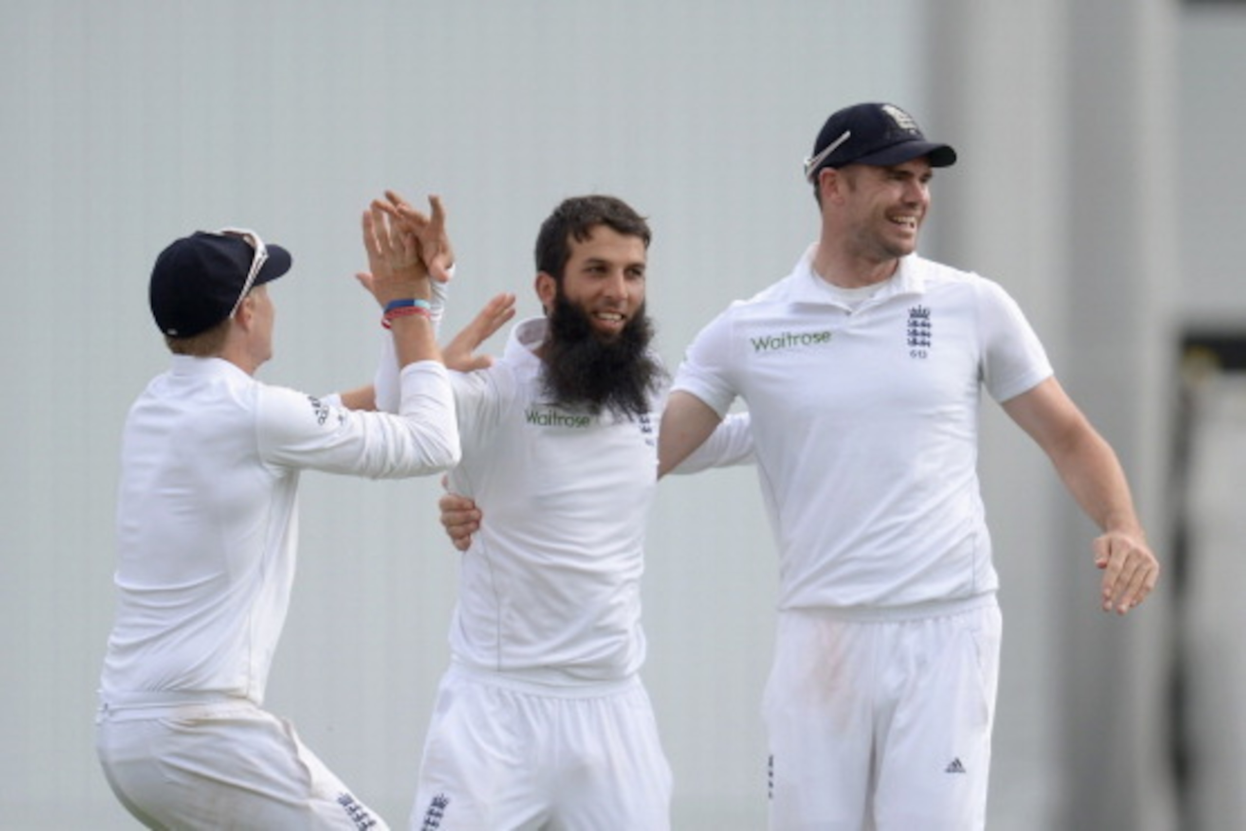 LEEDS, ENGLAND - JUNE 22:  Moeen Ali of England celebrates with Joe Root and James Anderson after dismissing Lahiru Thirimanne of Sri Lanka during day three of 2nd Investec Test match between England and Sri Lanka at Headingley Cricket Ground on June 22, 