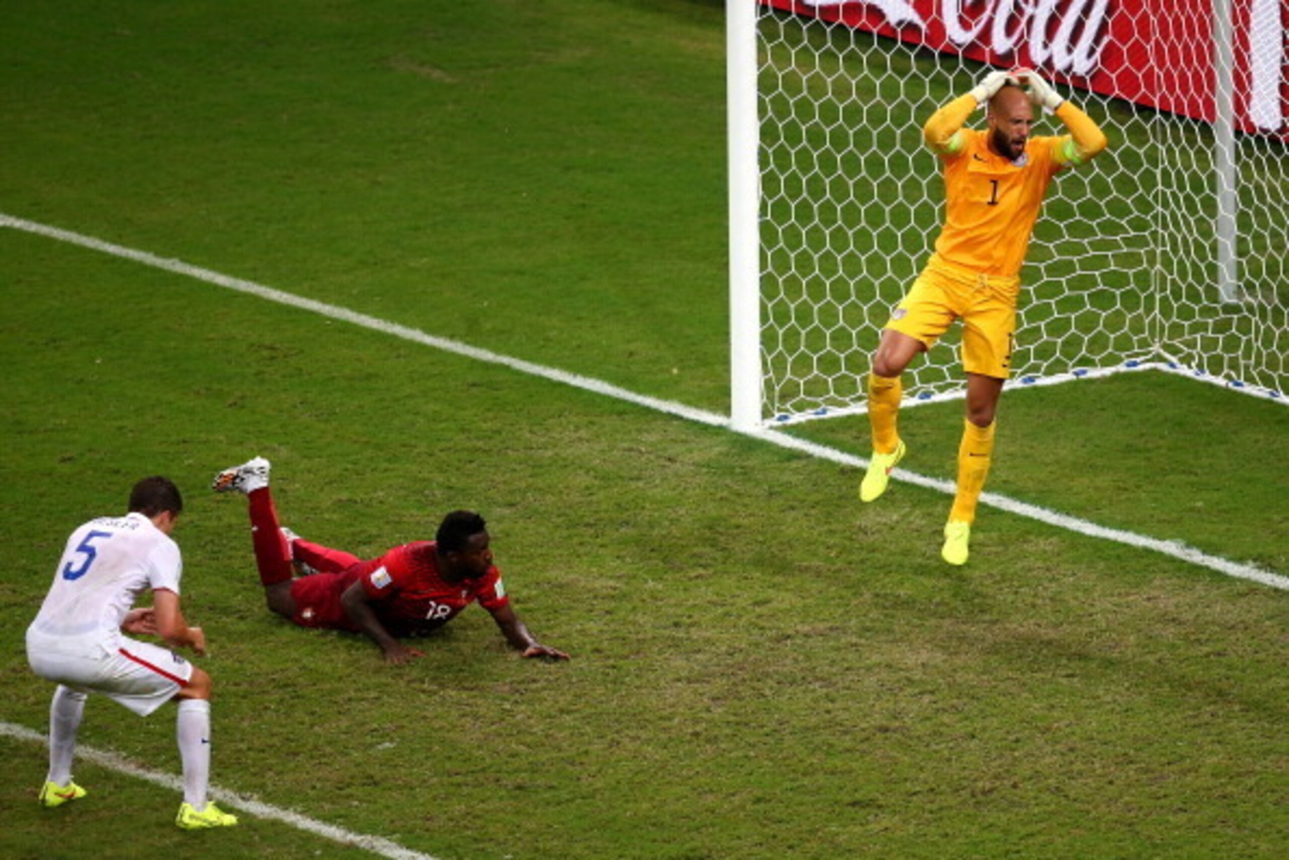 MANAUS, BRAZIL - JUNE 22:  Silvestre Varela of Portugal scores his team's second goal as goalkeeper Tim Howard of the United States looks on during the 2014 FIFA World Cup Brazil Group G match between the United States and Portugal at Arena Amazonia on Ju