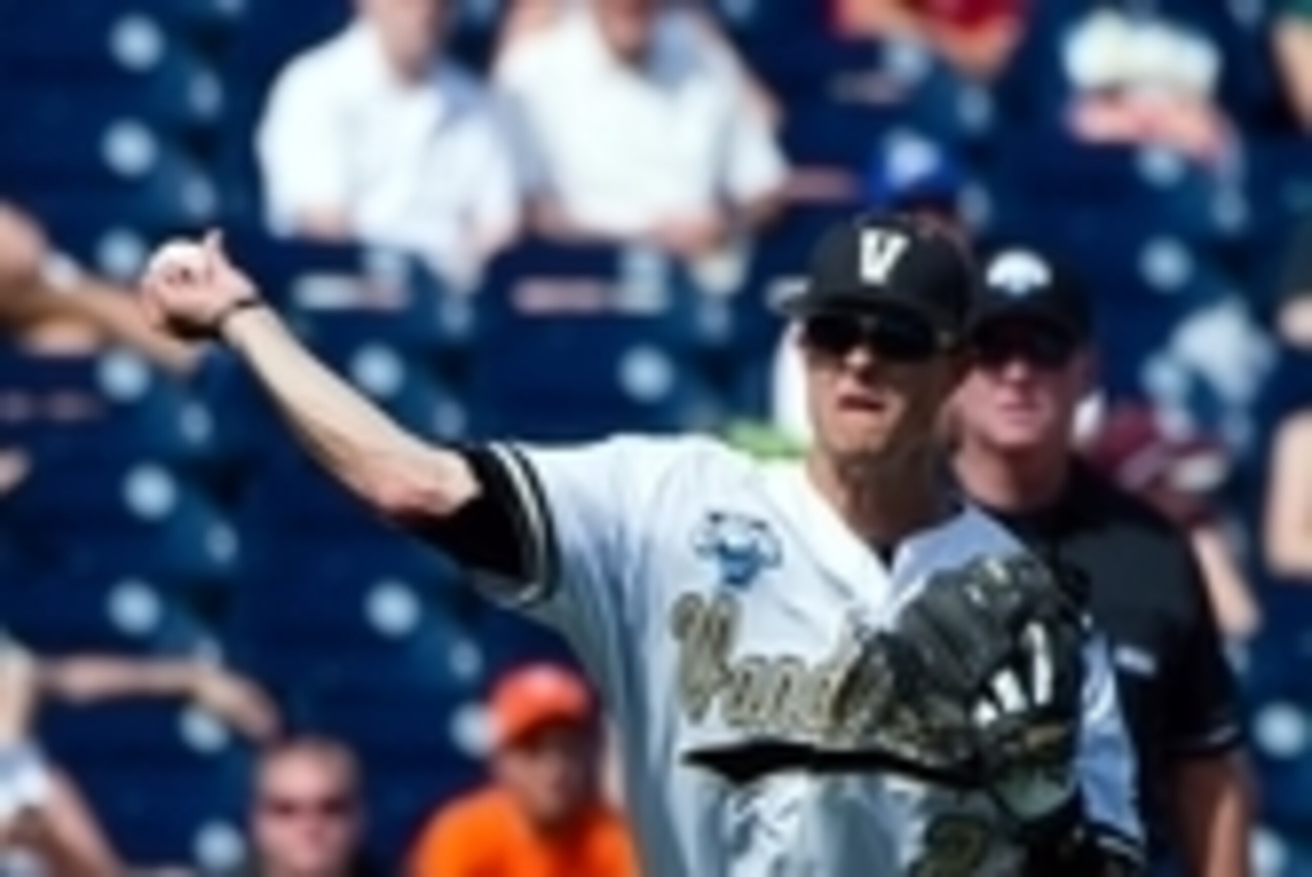Jun 20, 2014; Omaha, NE, USA; Vanderbilt Commodores infielder Tyler Campbell (2) throws to first base against the Texas Longhorns during game eleven of the 2014 College World Series at TD Ameritrade Park Omaha. Texas defeated Vanderbilt 4-0. Mandatory Cre