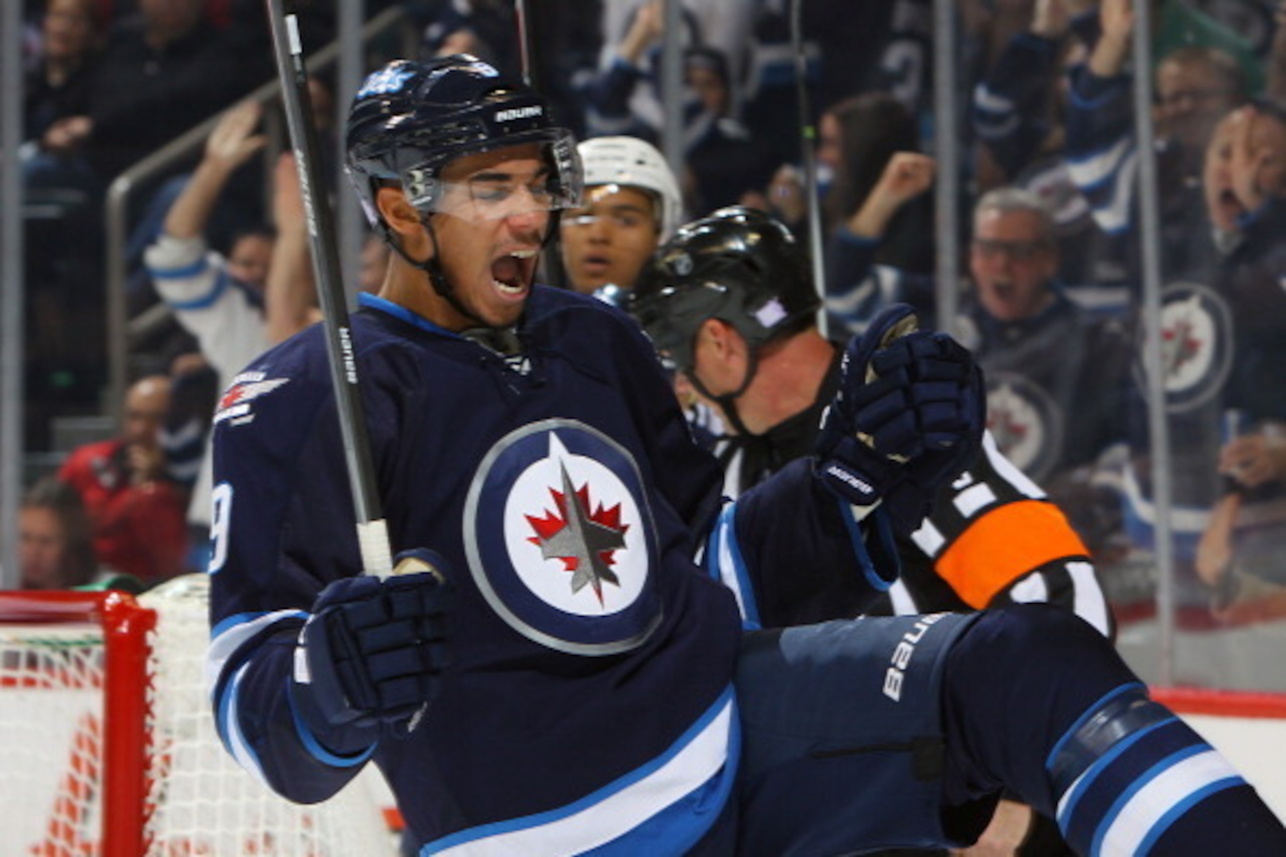 WINNIPEG, MB - OCTOBER 20: Evander Kane #9 of the Winnipeg Jets celebrates his third period goal against the Nashville Predators at the MTS Centre on October 20, 2013 in Winnipeg, Manitoba, Canada. (Photo by Jonathan Kozub/NHLI via Getty Images)