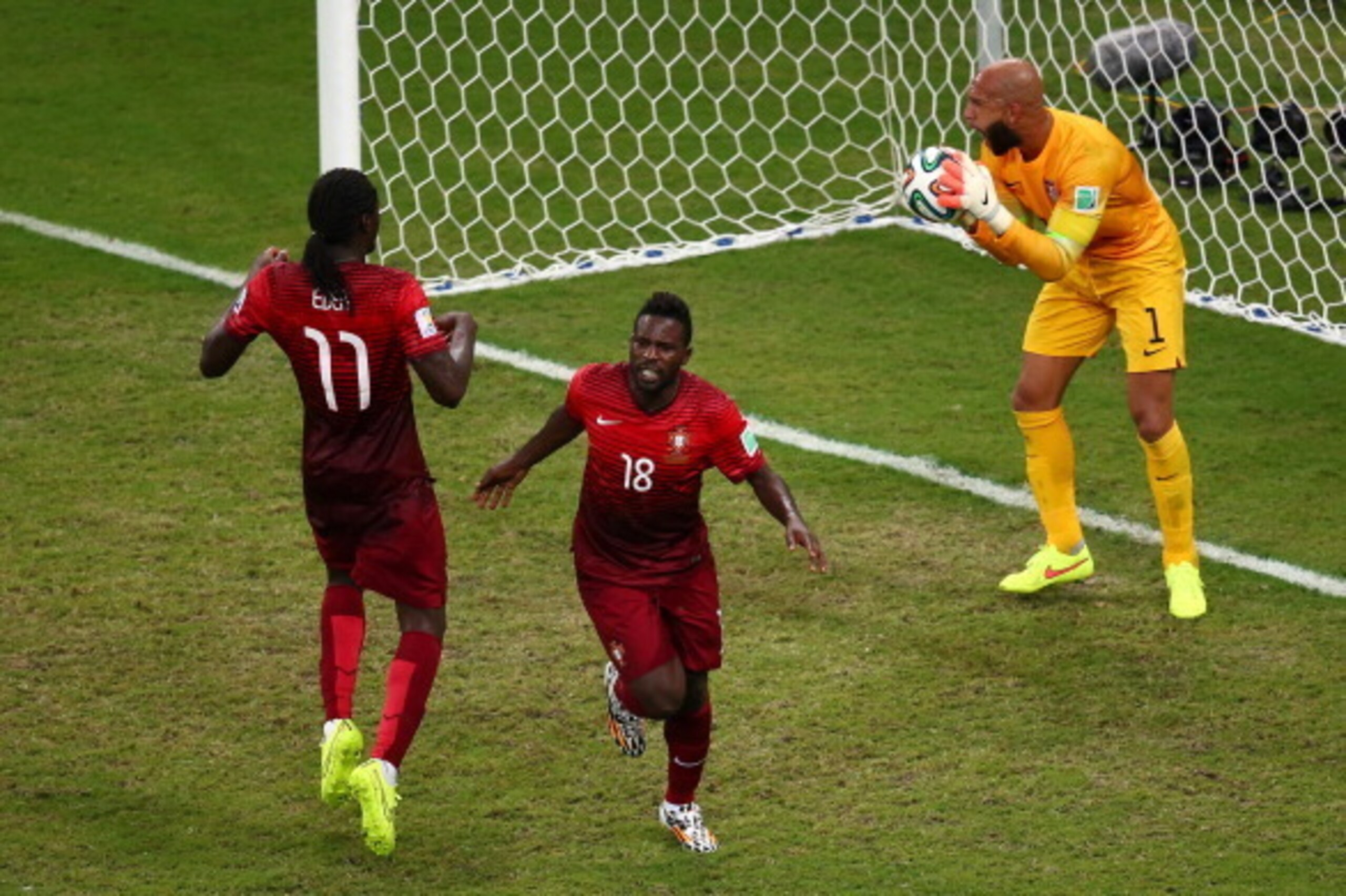 MANAUS, BRAZIL - JUNE 22: Silvestre Varela of Portugal celebrates scoring his team's second goal as goalkeeper Tim Howard of the United States looks on during the 2014 FIFA World Cup Brazil Group G match between the United States and Portugal at Arena Am MANAUS, BRAZIL - JUNE 22: Silvestre Varela of Portugal celebrates scoring his team's second goal as goalkeeper Tim Howard of the United States looks on during the 2014 FIFA World Cup Brazil Group G match between the United States and Portugal at Arena Am