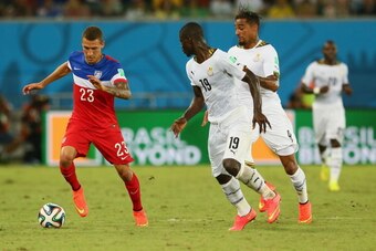 NATAL, BRAZIL - JUNE 16:  Fabian Johnson of the United States controls the ball against Jonathan Mensah of Ghana during the 2014 FIFA World Cup Brazil Group G match between Ghana and the United States at Estadio das Dunas on June 16, 2014 in Natal, Brazil
