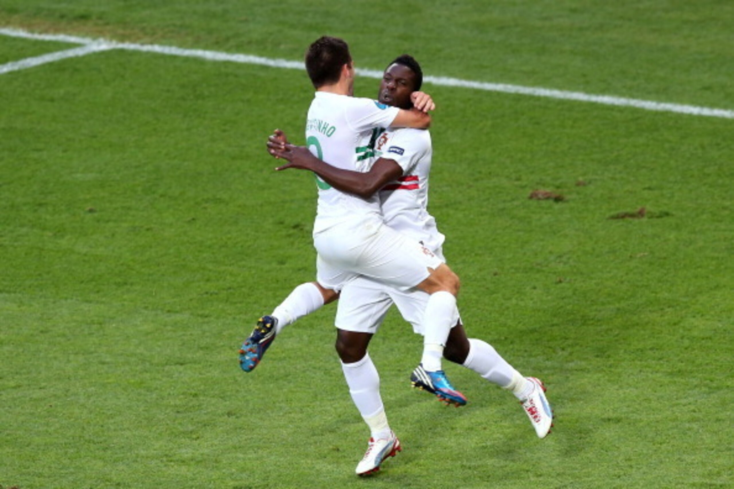 L'VIV, UKRAINE - JUNE 13:  Silvestre Varela of Portugal celebrates scoring their third goal with Joao Moutinho of Portugal during the UEFA EURO 2012 group B match between Denmark and Portugal at Arena Lviv on June 13, 2012 in L'viv, Ukraine.  (Photo by Al