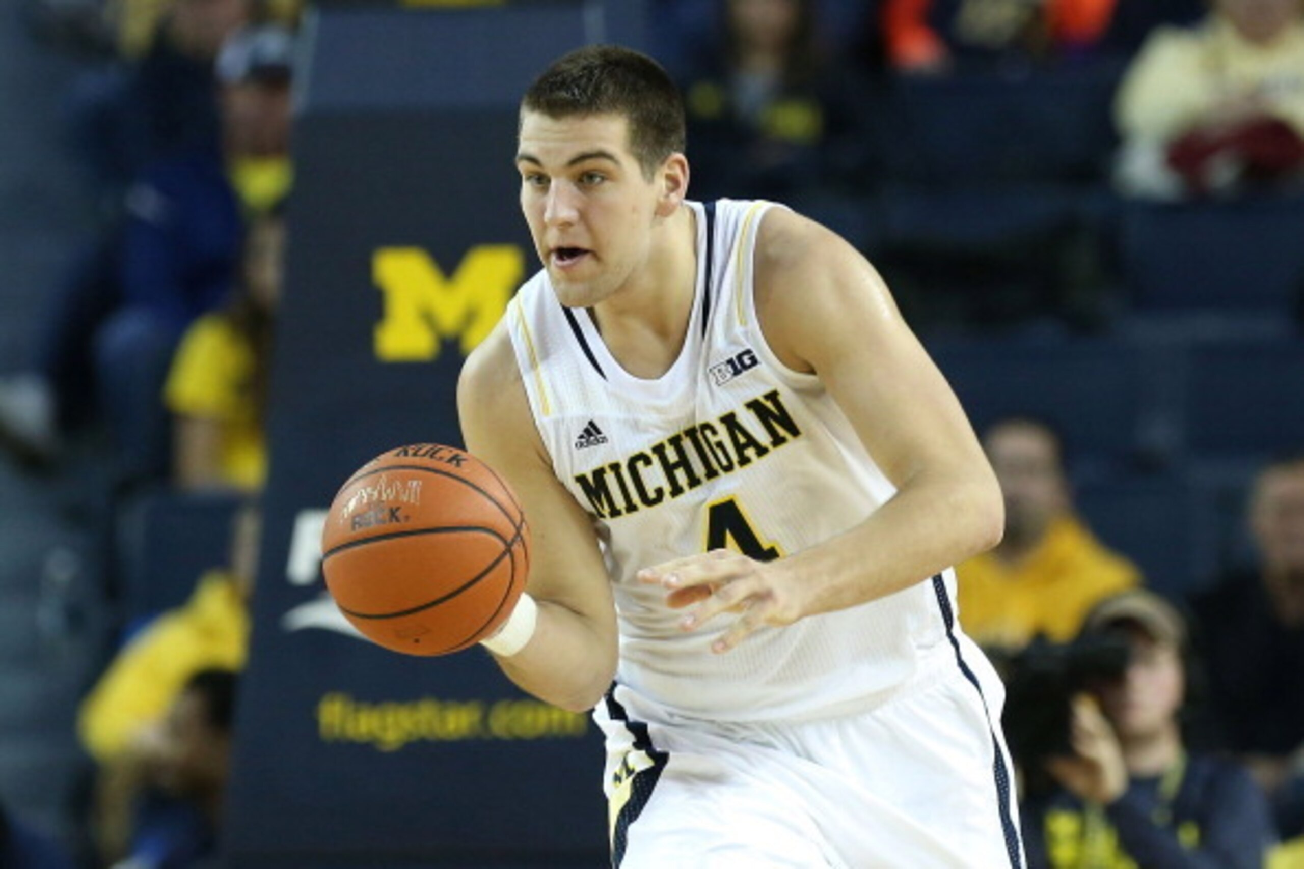 ANN ARBOR, MI - DECEMBER 07: Mitch McGary #4 of the University of Michigan Wolverines drives the ball up the court during the second half of the game against Houston Baptist Huskies at the Crisler Center on December 7, 2013 in Ann Arbor, Michigan. Michig ANN ARBOR, MI - DECEMBER 07: Mitch McGary #4 of the University of Michigan Wolverines drives the ball up the court during the second half of the game against Houston Baptist Huskies at the Crisler Center on December 7, 2013 in Ann Arbor, Michigan. Michig