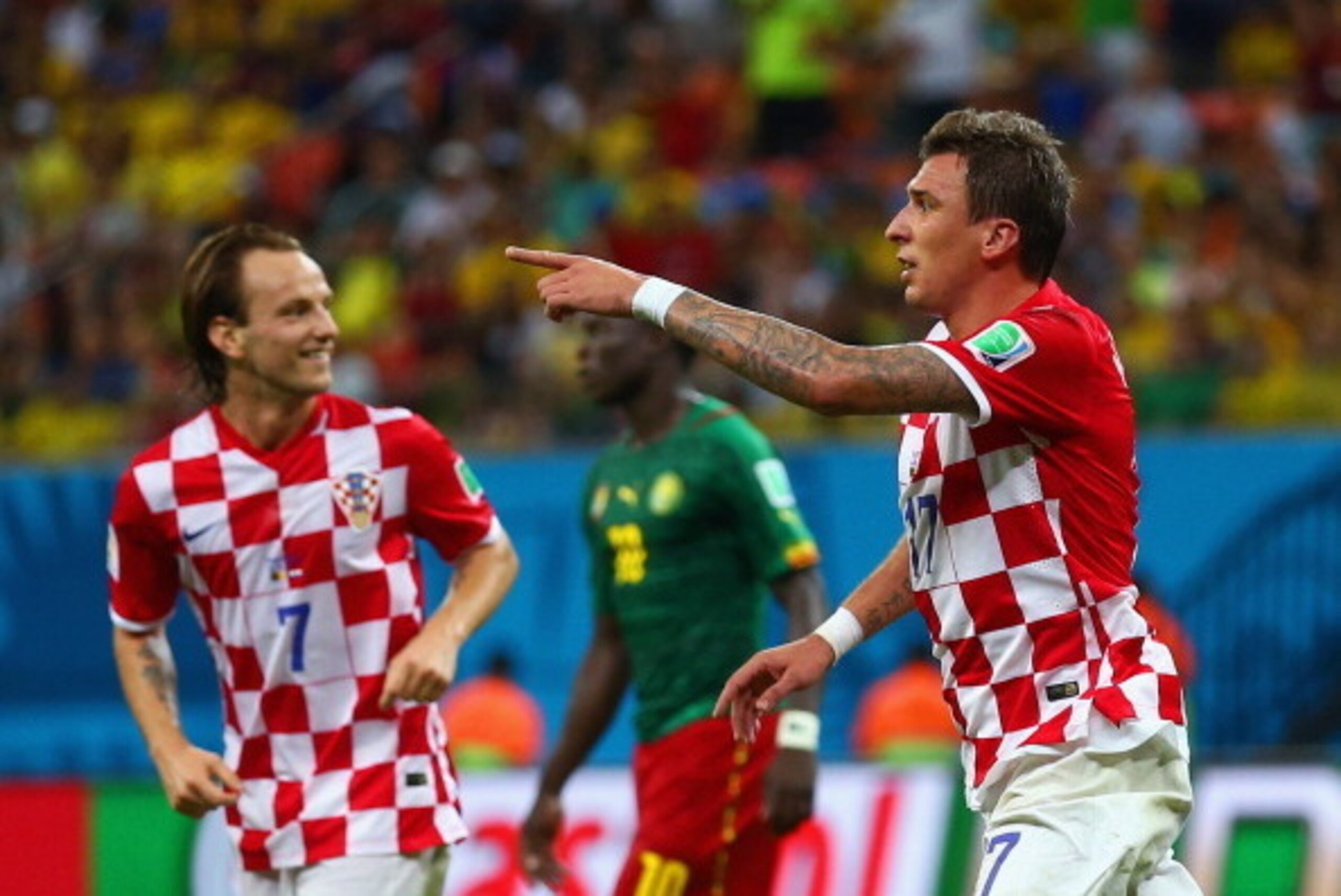 MANAUS, BRAZIL - JUNE 18:  Mario Mandzukic of Croatia (R) celebrates scoring his team's third goal with Ivan Rakitic during the 2014 FIFA World Cup Brazil Group A match between Cameroon and Croatia at Arena Amazonia on June 18, 2014 in Manaus, Brazil.  (P