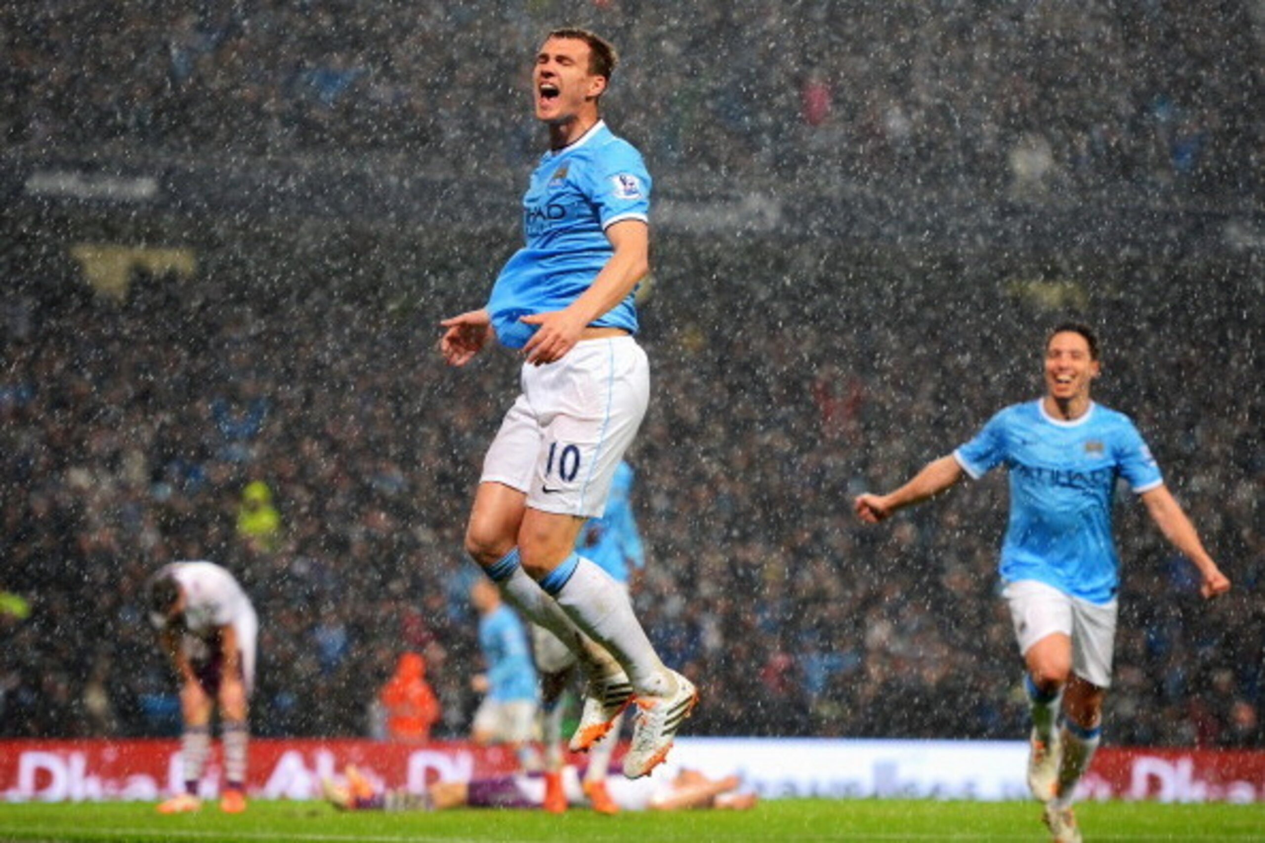 MANCHESTER, ENGLAND - MAY 07:  Edin Dzeko of Manchester City celebrates scoring the opening goal during the Barclays Premier League match between Manchester City and Aston Villa at Etihad Stadium on May 7, 2014 in Manchester, England.  (Photo by Michael R