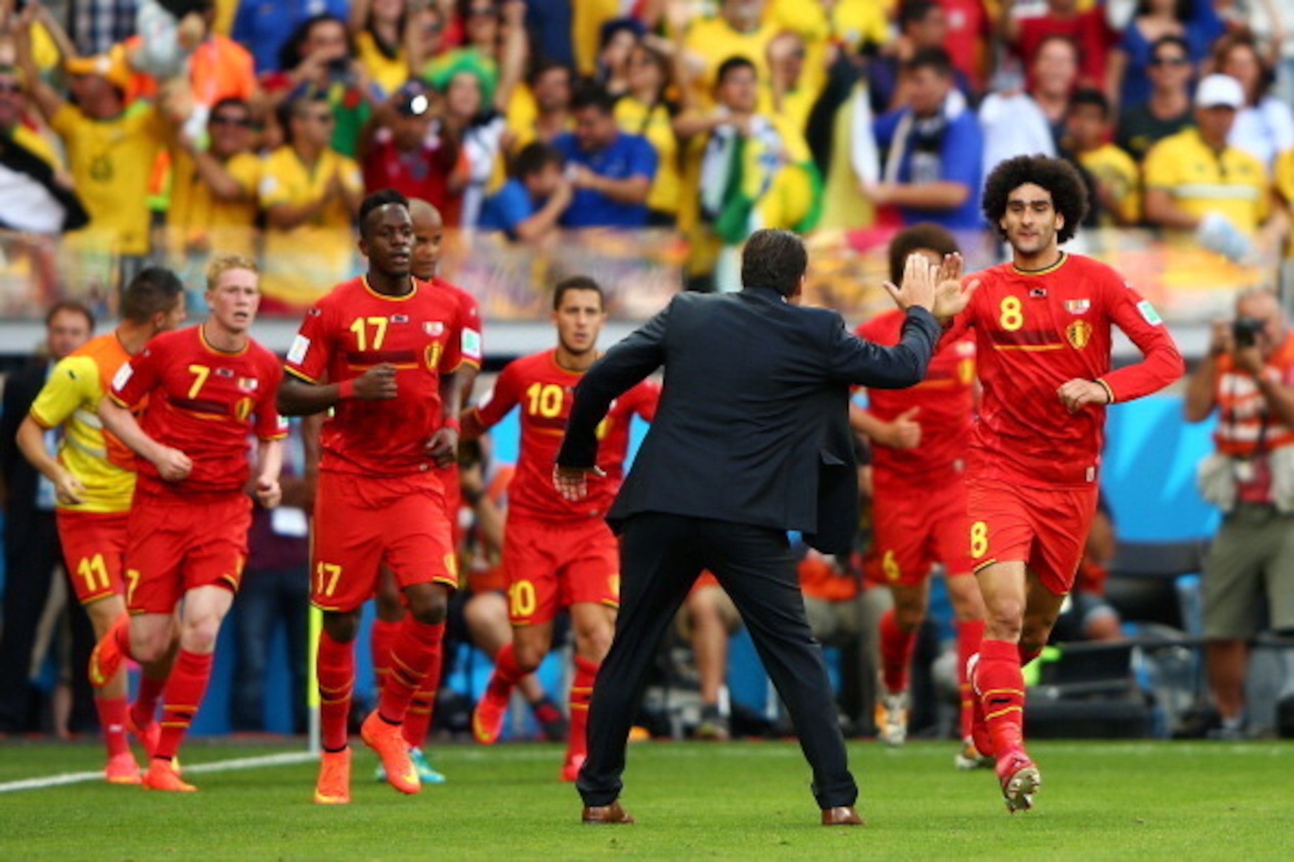 BELO HORIZONTE, BRAZIL - JUNE 17:  Marouane Fellaini of Belgium (R) celebrates scoring his team's first goal with head coach Marc Wilmots during the 2014 FIFA World Cup Brazil Group H match between Belgium and Algeria at Estadio Mineirao on June 17, 2014 