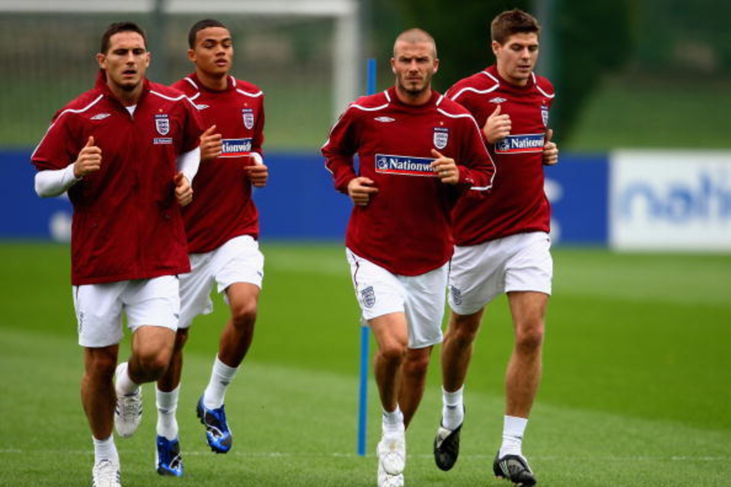 LONDON COLNEY, UNITED KINGDOM - OCTOBER 07:  (L-R) Frank Lampard, Jermaine Jenas, David Beckham and Steven Gerrard of England warm up during an England training session at London Colney Training Ground on October 7, 2008 in London, England.  (Photo by Jam