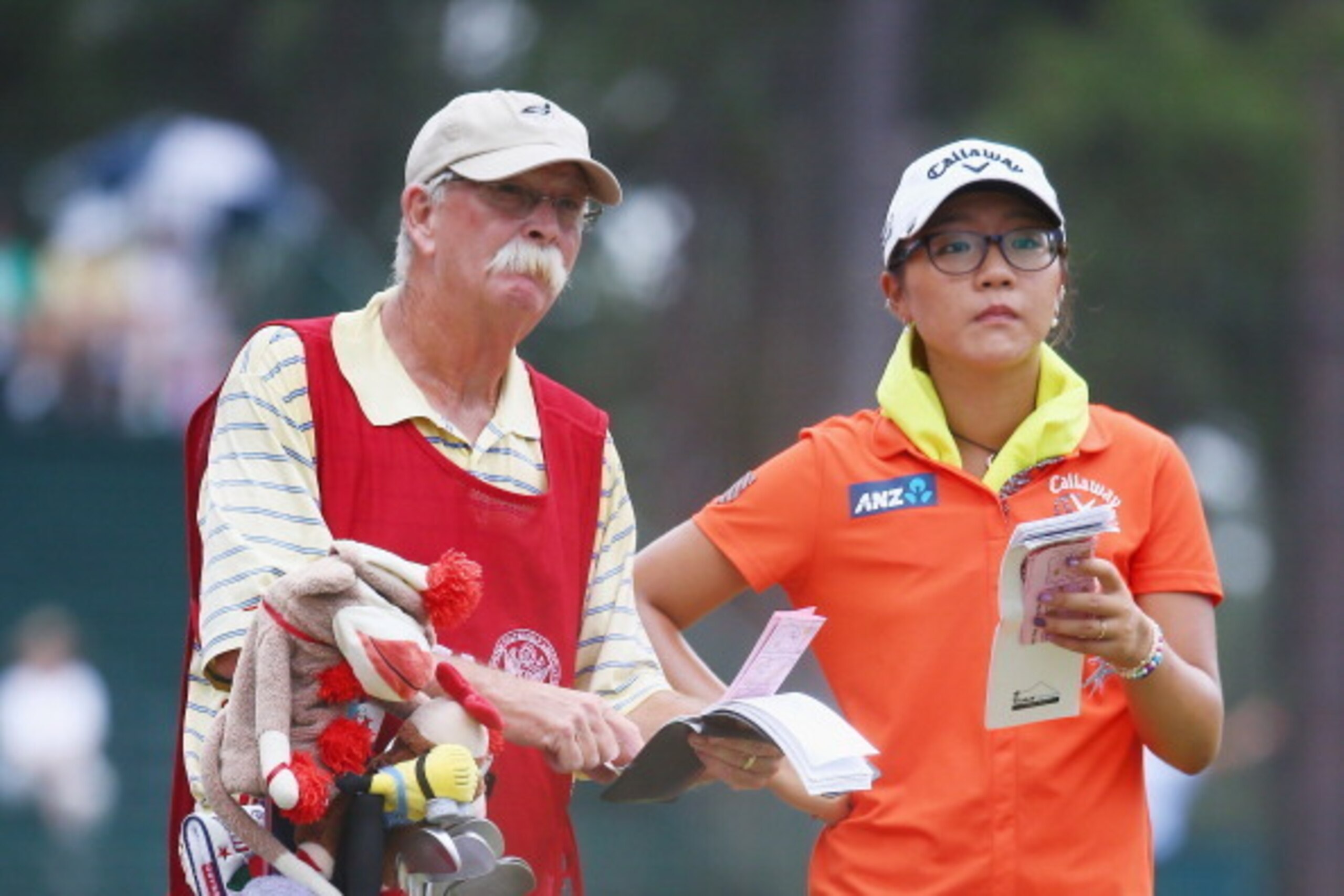 PINEHURST, NC - JUNE 21:  Lydia Ko of New Zealand chats with her caddie Mike Cowan on the 13th hole during the third round of the 69th U.S. Women's Open at Pinehurst Resort & Country Club, Course No. 2 on June 21, 2014 in Pinehurst, North Carolina.  (Phot