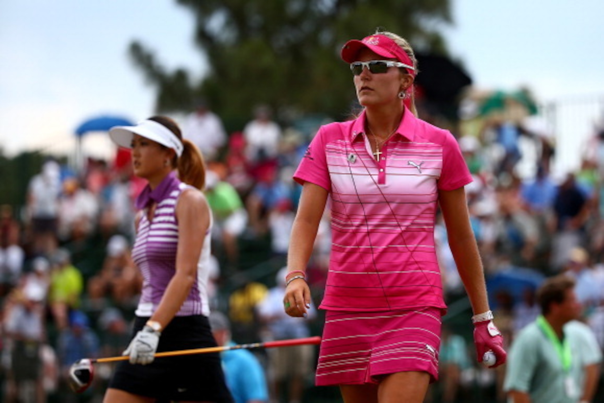 PINEHURST, NC - JUNE 21:  (L-R) Michelle Wie of the United States walks off the 14th hole with Lexi Thompson of the United States during the third round of the 69th U.S. Women's Open at Pinehurst Resort & Country Club, Course No. 2 on June 21, 2014 in Pin