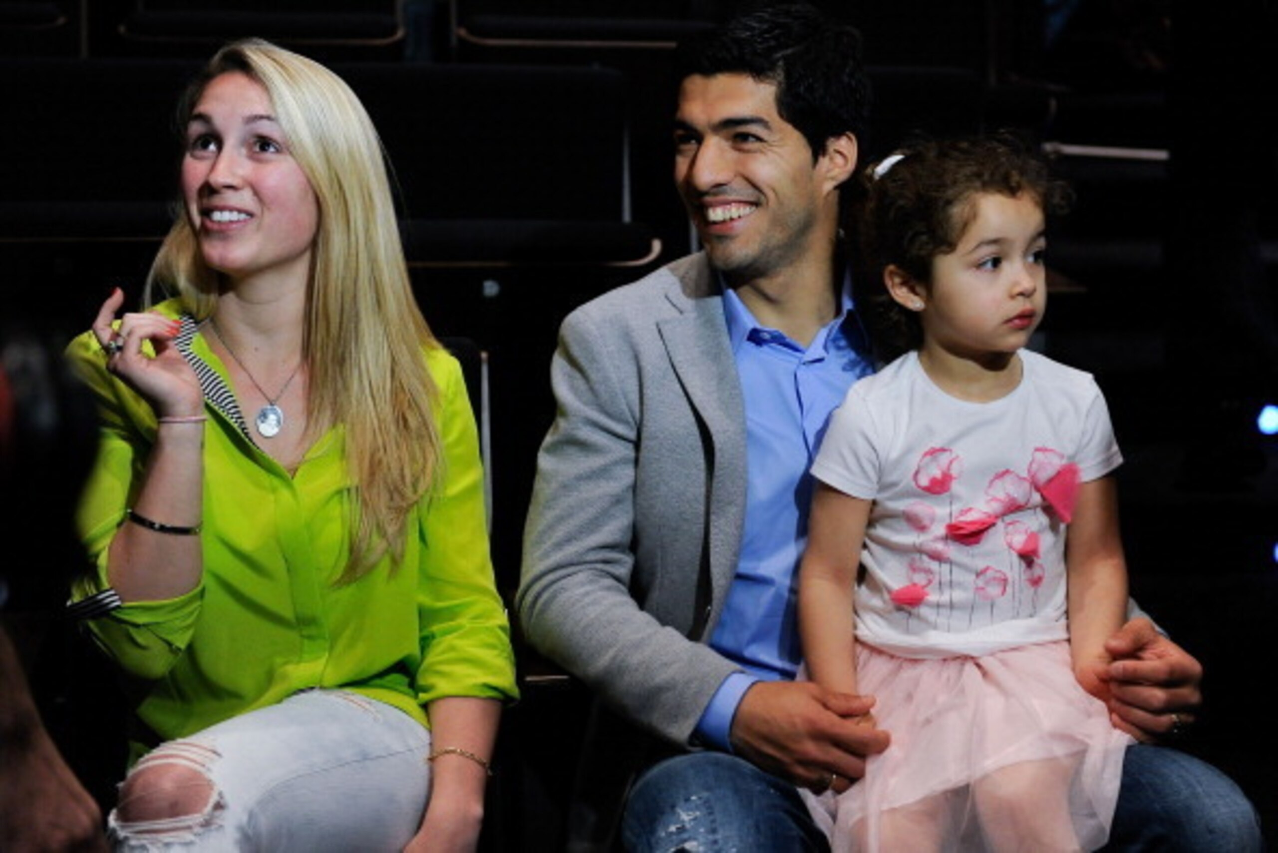 BARCELONA, SPAIN - MAY 14:  Luis Suarez of Liverpool and his wife Sofia Balbi sit with their daughter Delfina during the presentation as new Ambassador for 888poker on May 14, 2014 in Barcelona, Spain.  (Photo by David Ramos/Getty Images)
