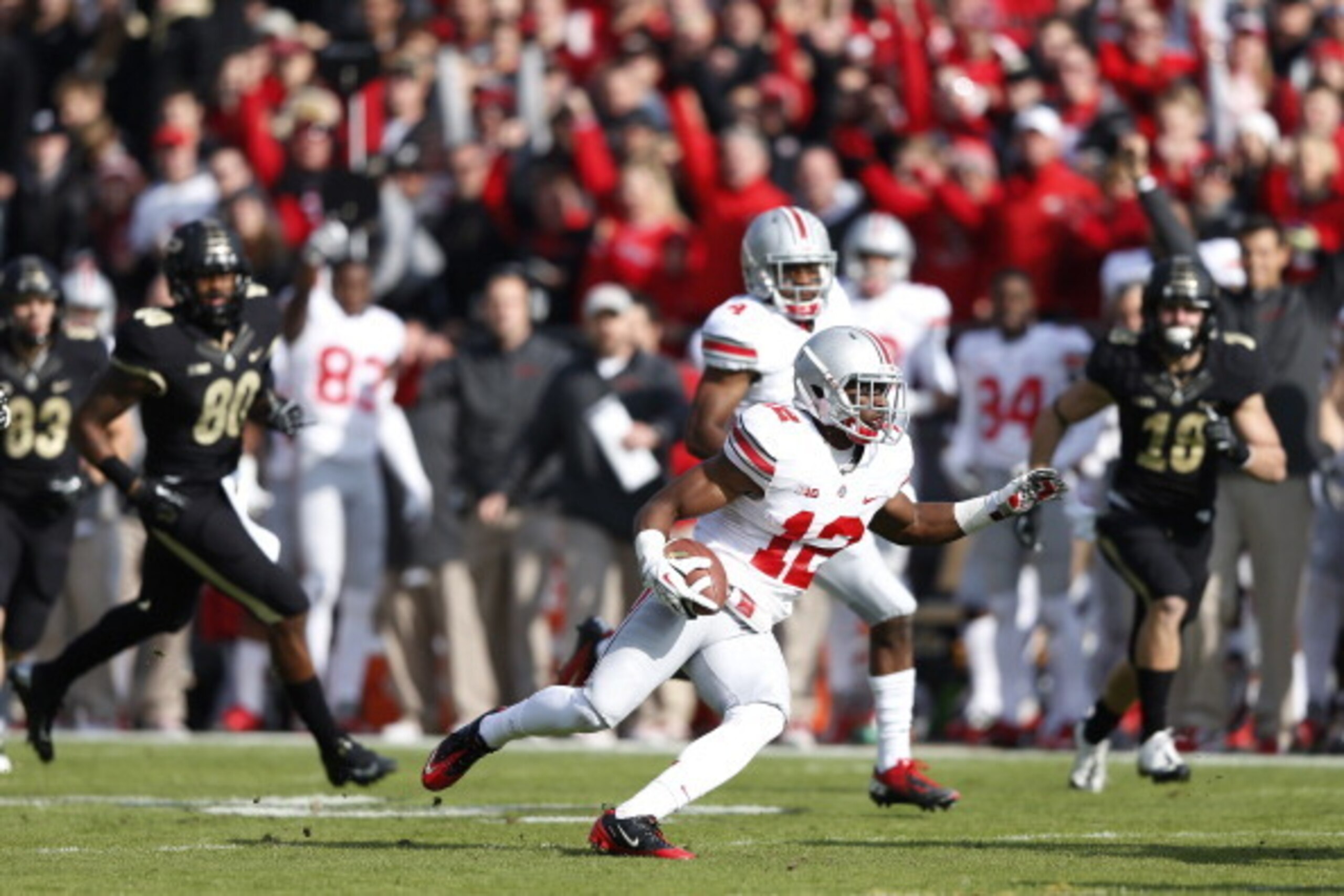 WEST LAFAYETTE, IN - NOVEMBER 2: Doran Grant #12 of the Ohio State Buckeyes returns an interception for a 33-yard touchdown in the first half of the game against the Purdue Boilermakers at Ross-Ade Stadium on November 2, 2013 in West Lafayette, Indiana. (