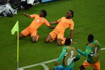 RECIFE, BRAZIL - JUNE 14:  Gervinho of the Ivory Coast (L) celebrates scoring his team's second goal with teammate Didier Drogba during the 2014 FIFA World Cup Brazil Group C match  between the Ivory Coast and Japan at Arena Pernambuco on June 14, 2014 in