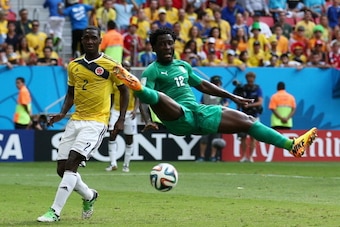 BRASILIA, BRAZIL - JUNE 19: Cristian Zapata of Colombia competes for the ball with Wilfried Bony of the Ivory Coast during the 2014 FIFA World Cup Brazil Group C match between Colombia and Cote D'Ivoire at Estadio Nacional on June 19, 2014 in Brasilia, Br