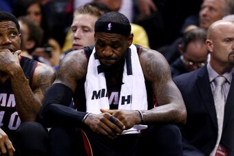 SAN ANTONIO, TX - JUNE 15:  LeBron James #6 of the Miami Heat reacts on the bench against the San Antonio Spurs during Game Five of the 2014 NBA Finals at the AT&T Center on June 15, 2014 in San Antonio, Texas. NOTE TO USER: User expressly acknowledges an