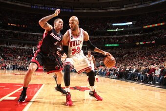 CHICAGO, IL - MARCH 9: Taj Gibson #22 of the Chicago Bulls handles the ball against the Miami Heat during a game at the United Center in Chicago. NOTE TO USER: User expressly acknowledges and agrees that, by downloading and or using this photograph, User 