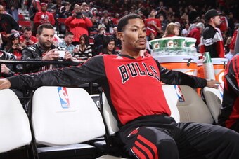 PORTLAND, OR - NOVEMBER 22:  Derrick Rose #1 of the Chicago Bulls sits on the bench before the game against the Portland Trail Blazers on November 22, 2013 at the Moda Center Arena in Portland, Oregon. NOTE TO USER: User expressly acknowledges and agrees 