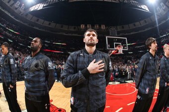 CHICAGO, IL - JANUARY 27:  Kevin Love #42 of the Minnesota Timberwolves during the national anthem before the game  against the Chicago Bulls on JANUARY 27, 2014 at the United Center in Chicago, Illinois. NOTE TO USER: User expressly acknowledges and agre