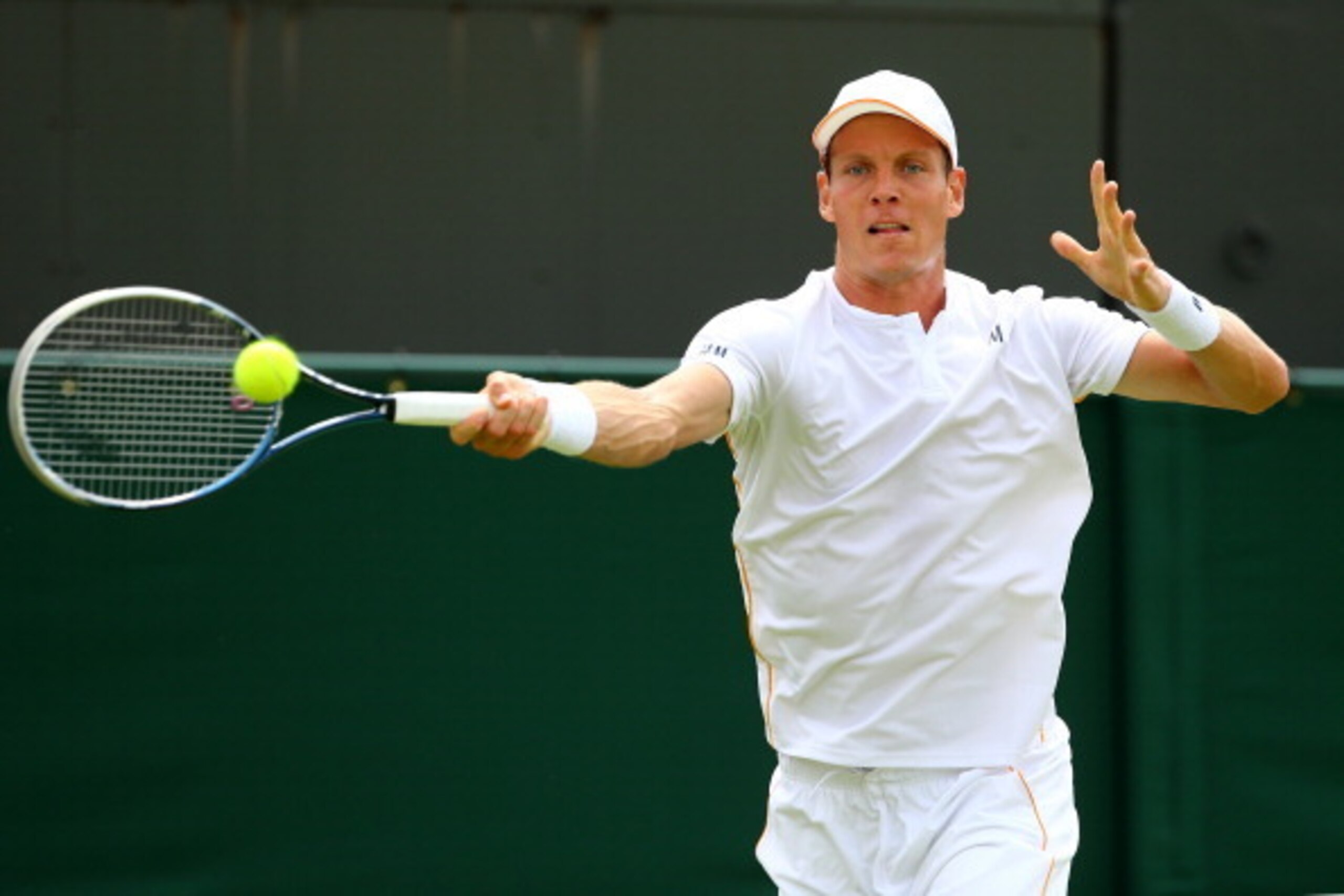 LONDON, ENGLAND - JUNE 23:  Tomas Berdych of Czech Republic plays a forehand during his Gentlemen's Singles first round match against Victor Hanescu of Romania on day one of the Wimbledon Lawn Tennis Championships at the All England Lawn Tennis and Croque