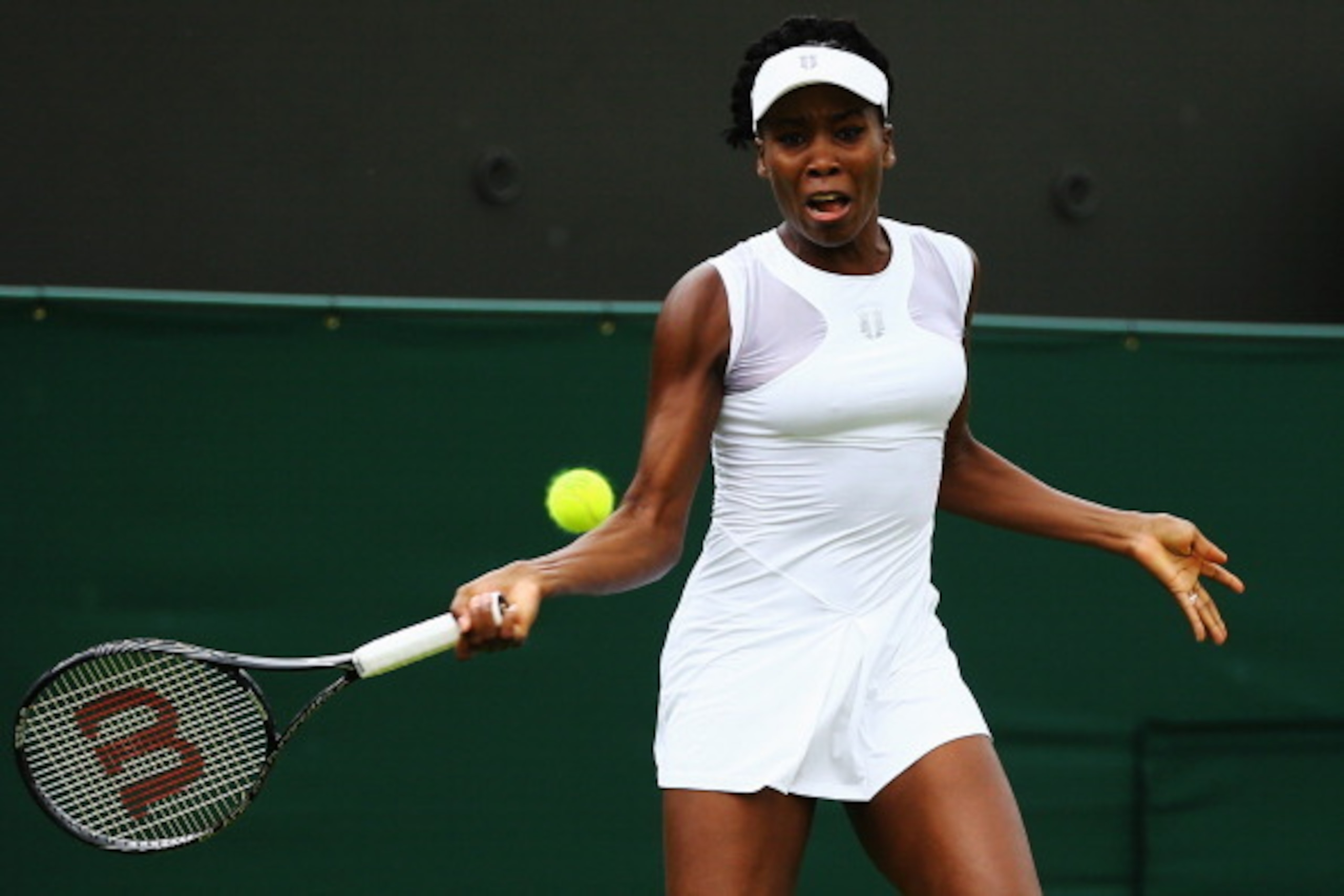 LONDON, ENGLAND - JUNE 23: Venus Williams of the United States in action during her Ladies' Singles first round match against Maria-Teresa Torro-Flor of Spain on day one of the Wimbledon Lawn Tennis Championships at the All England Lawn Tennis and Croque LONDON, ENGLAND - JUNE 23: Venus Williams of the United States in action during her Ladies' Singles first round match against Maria-Teresa Torro-Flor of Spain on day one of the Wimbledon Lawn Tennis Championships at the All England Lawn Tennis and Croque