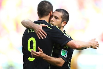 CURITIBA, BRAZIL - JUNE 23: Fernando Torres of Spain (L) celebrates scoring his team's second goal with Jordi Alba during the 2014 FIFA World Cup Brazil Group B match between Australia and Spain at Arena da Baixada on June 23, 2014 in Curitiba, Brazil.  (