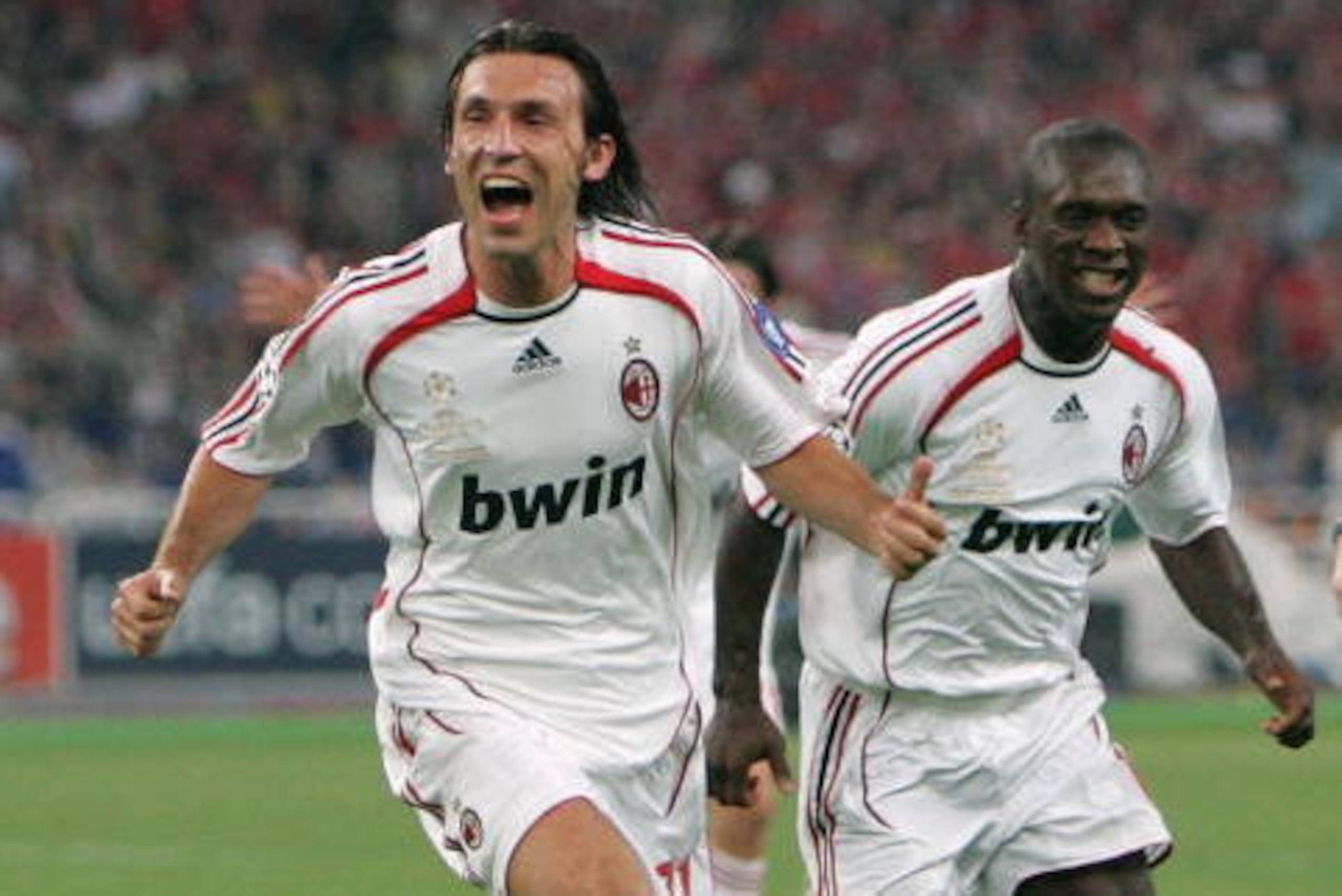 ATHENS, GREECE - MAY 23:  Andrea Pirlo (L) of Milan celebrates with teammate, Clarence Seedorf (R) after taking the free kick, that lead to teammate Filippo Inzaghi scoring the opening goal during the UEFA Champions League Final match between Liverpool an