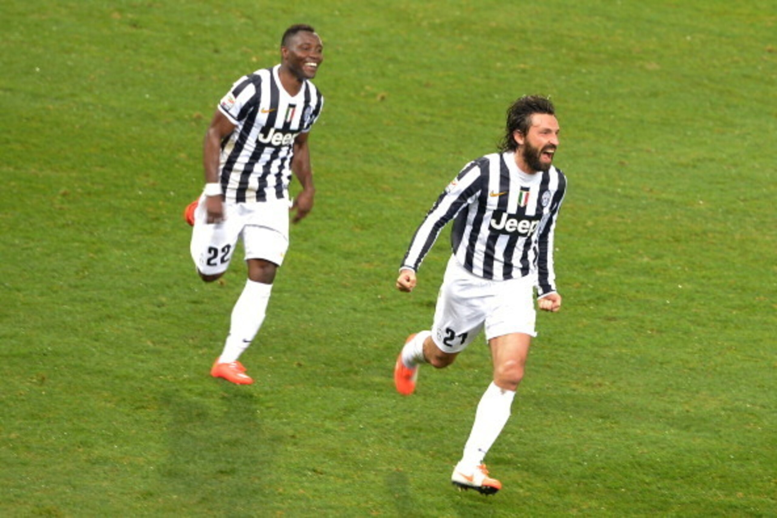GENOA, ITALY - MARCH 16:  Andrea Pirlo (R) of Juventus celebrates after scoring the opening goal during the Serie A match between Genoa CFC and Juventus at Stadio Luigi Ferraris on March 16, 2014 in Genoa, Italy.  (Photo by Tullio M. Puglia/Getty Images)
