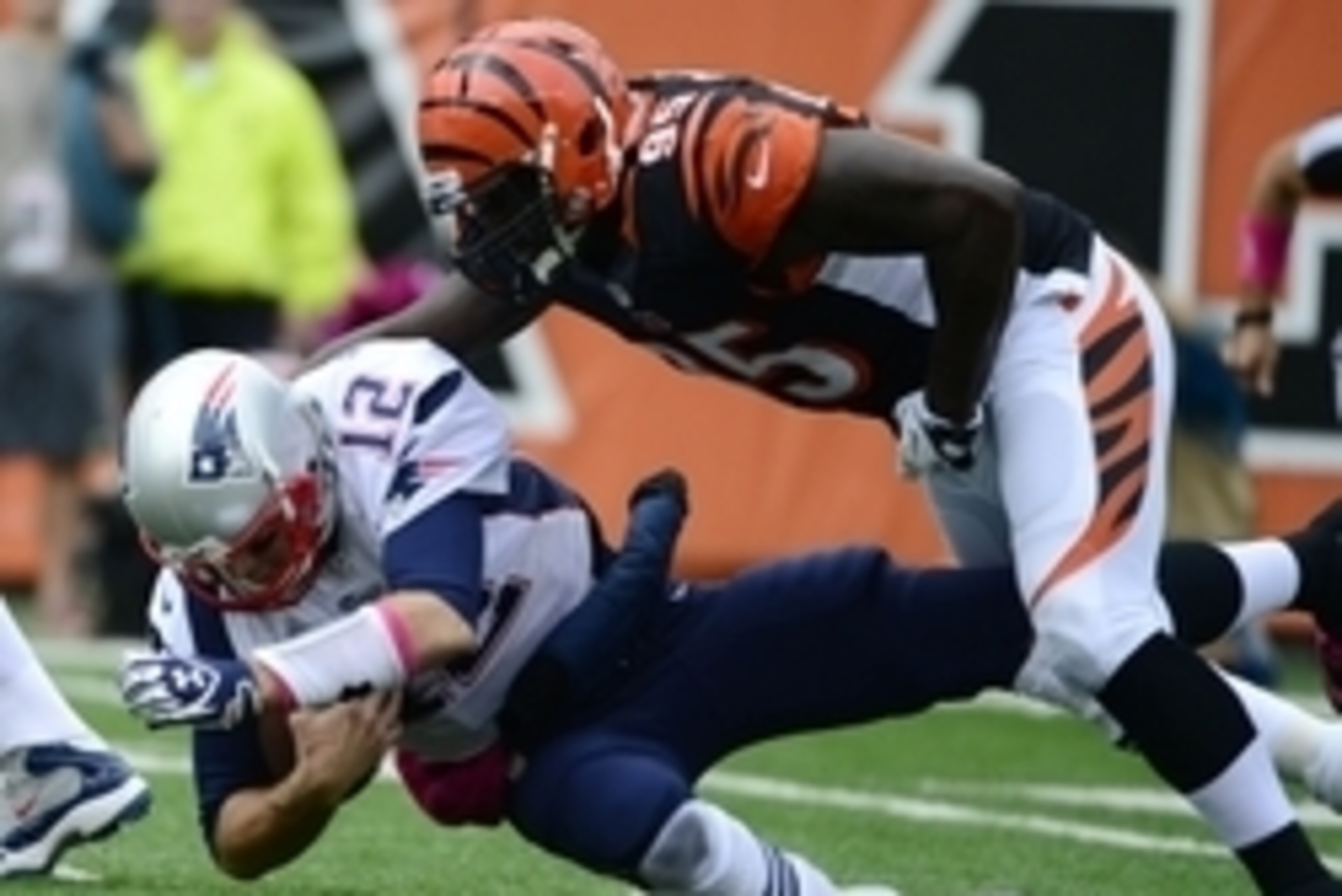 Oct 6, 2013; Cincinnati, OH, USA; New England Patriots quarterback Tom Brady (12) gets sacked by Cincinnati Bengals defensive end Wallace Gilberry (95) in the first half at Paul Brown Stadium. Mandatory Credit: Marc Lebryk-USA TODAY Sports Oct 6, 2013; Cincinnati, OH, USA; New England Patriots quarterback Tom Brady (12) gets sacked by Cincinnati Bengals defensive end Wallace Gilberry (95) in the first half at Paul Brown Stadium. Mandatory Credit: Marc Lebryk-USA TODAY Sports