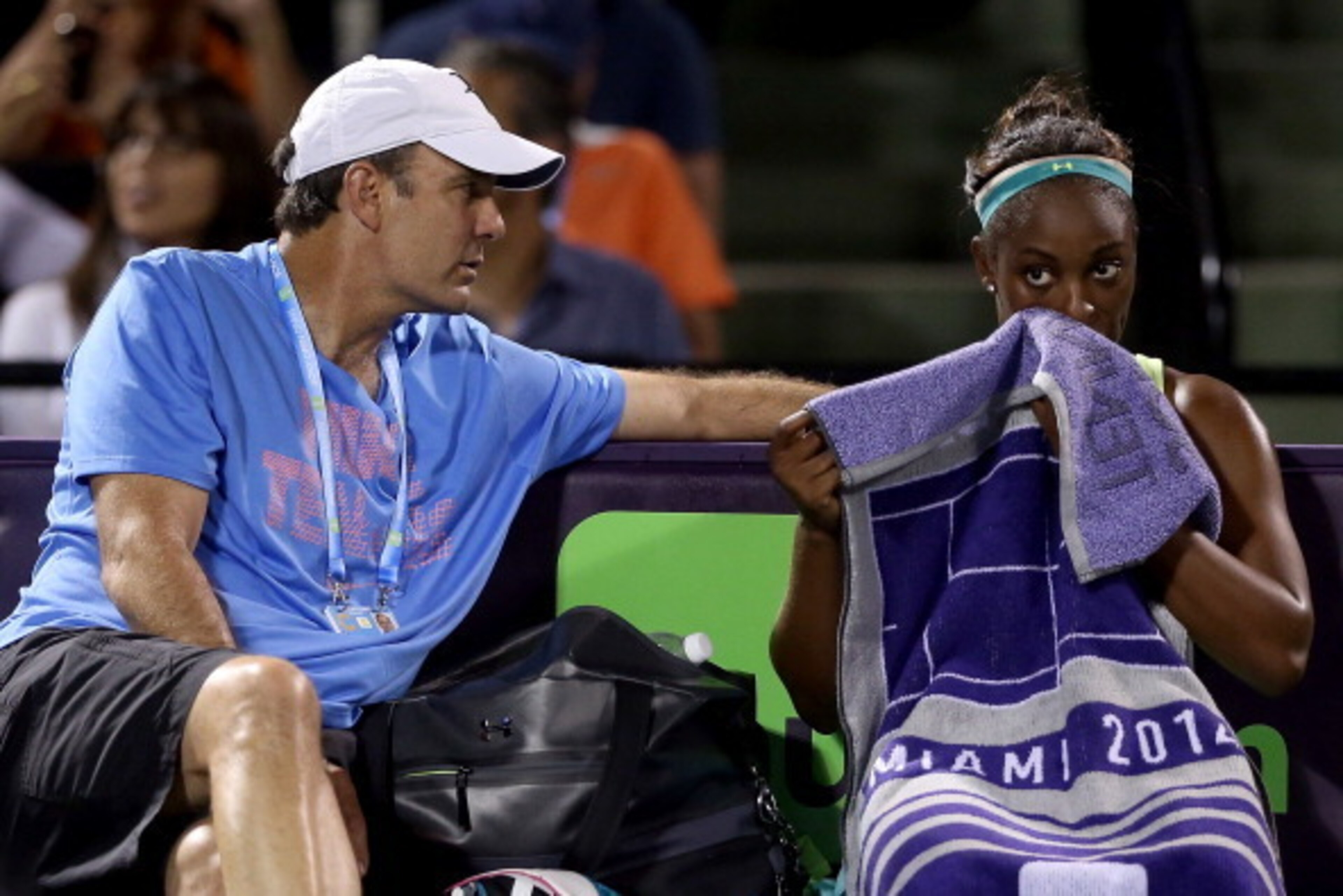 KEY BISCAYNE, FL - MARCH 23:  Coach Paul Annacone confers with Sloane Stephens between sets against Caroline Wozniacki of Denmark during the Sony Open at the Crandon Park Tennis Center on March 23, 2014 in Key Biscayne, Florida.  (Photo by Matthew Stockma