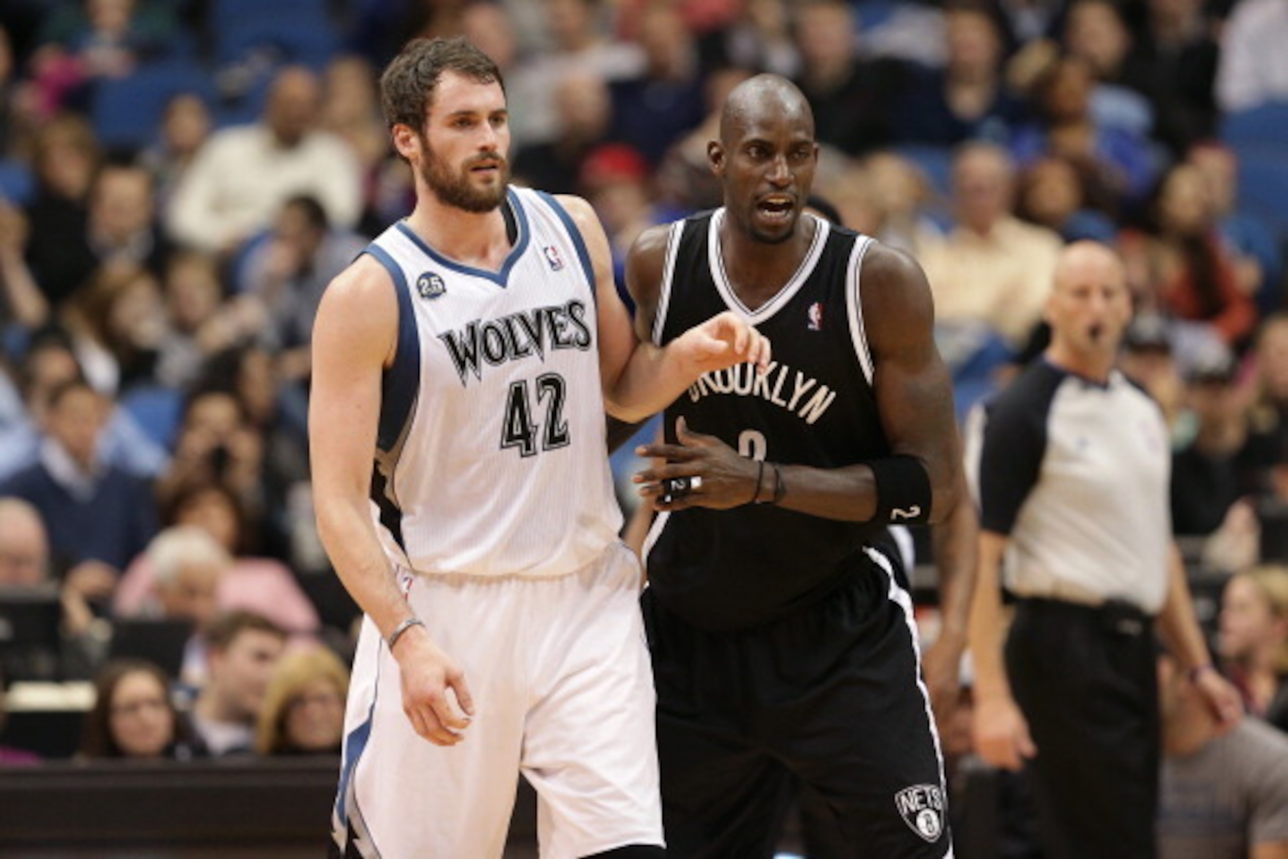 MINNEAPOLIS, MN - NOVEMBER 22:  Kevin Love #42 of the Minnesota Timberwolves boxes out Kevin Garnett #2 of the Brooklyn Nets on November 22, 2013 at Target Center in Minneapolis, Minnesota. NOTE TO USER: User expressly acknowledges and agrees that, by dow