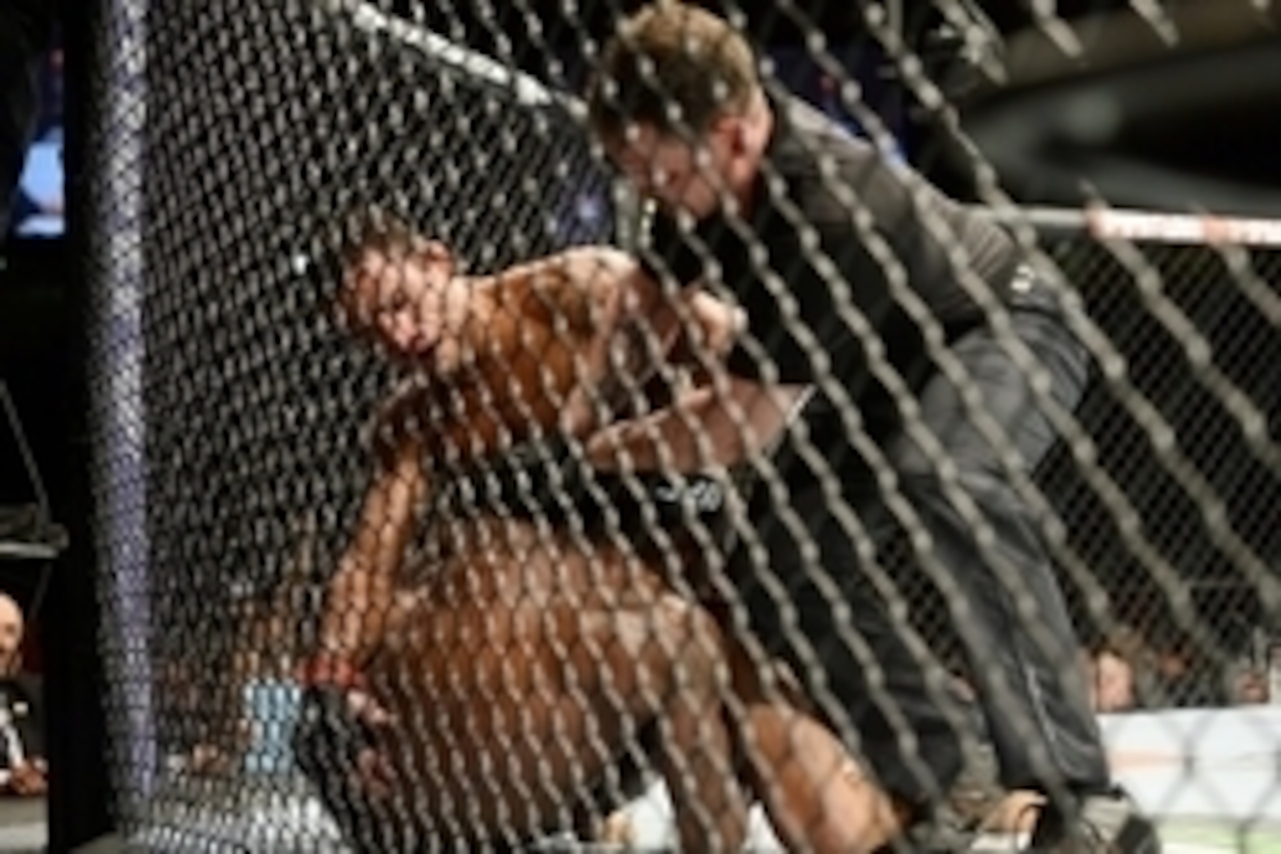 Jun 7, 2014; Albuquerque, NM, USA; Rafael Dos Anjos (red) and Jason High (blue) fight during their lightweight bout during UFC Fight Night 42 at Tingley Coliseum. Dos Anjos won via second round stoppage. Mandatory Credit: Joe Camporeale-USA TODAY Sports Jun 7, 2014; Albuquerque, NM, USA; Rafael Dos Anjos (red) and Jason High (blue) fight during their lightweight bout during UFC Fight Night 42 at Tingley Coliseum. Dos Anjos won via second round stoppage. Mandatory Credit: Joe Camporeale-USA TODAY Sports