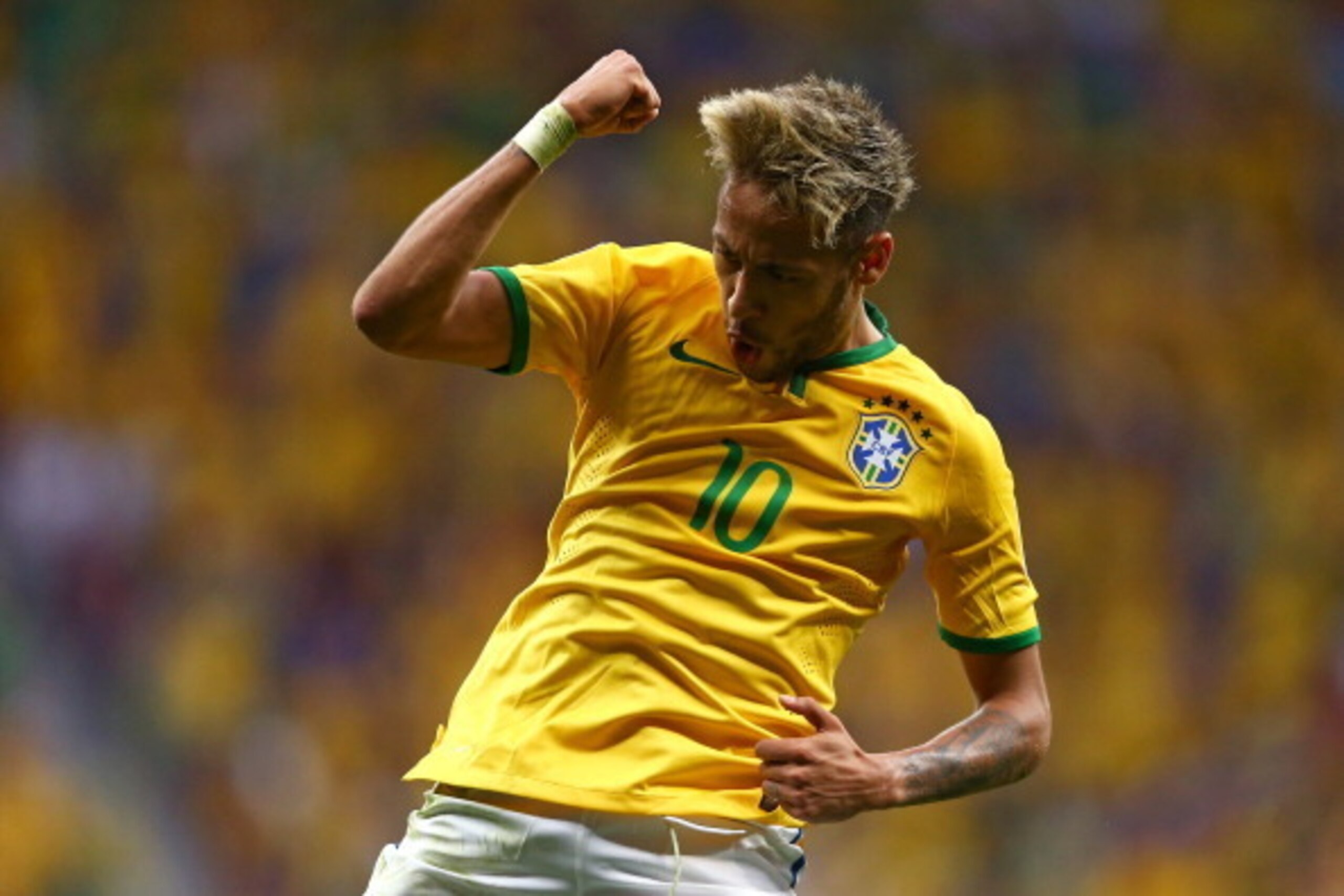 BRASILIA, BRAZIL - JUNE 23:  Neymar of Brazil celebrates scoring his team's second goal and his second of the game during the 2014 FIFA World Cup Brazil Group A match between Cameroon and Brazil at Estadio Nacional on June 23, 2014 in Brasilia, Brazil.  (