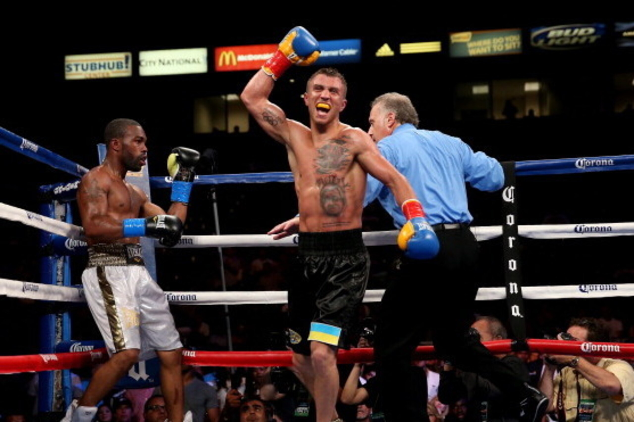 LOS ANGELES, CA - JUNE 21:  Vasyl Lomachenko celebrates after the final bell against Gary Russell Jr. in their WBO Featherwieight Title bout at StubHub Center on June 21, 2014 in Los Angeles, California.  Lomachenko won by split decision.  (Photo by Steph