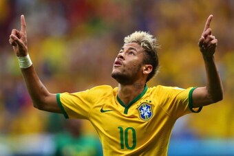BRASILIA, BRAZIL - JUNE 23:  Neymar of Brazil celebrates scoring his team's second goal and his second of the game during the 2014 FIFA World Cup Brazil Group A match between Cameroon and Brazil at Estadio Nacional on June 23, 2014 in Brasilia, Brazil.  (