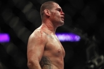 Oct 19, 2013; Houston, TX, USA; Cain Velasquez (red gloves) fights against Junior Dos Santos (not pictured) in the world heavyweight championship bout during UFC 166 at Toyota Center. Mandatory Credit: Andrew Richardson-USA TODAY Sports
