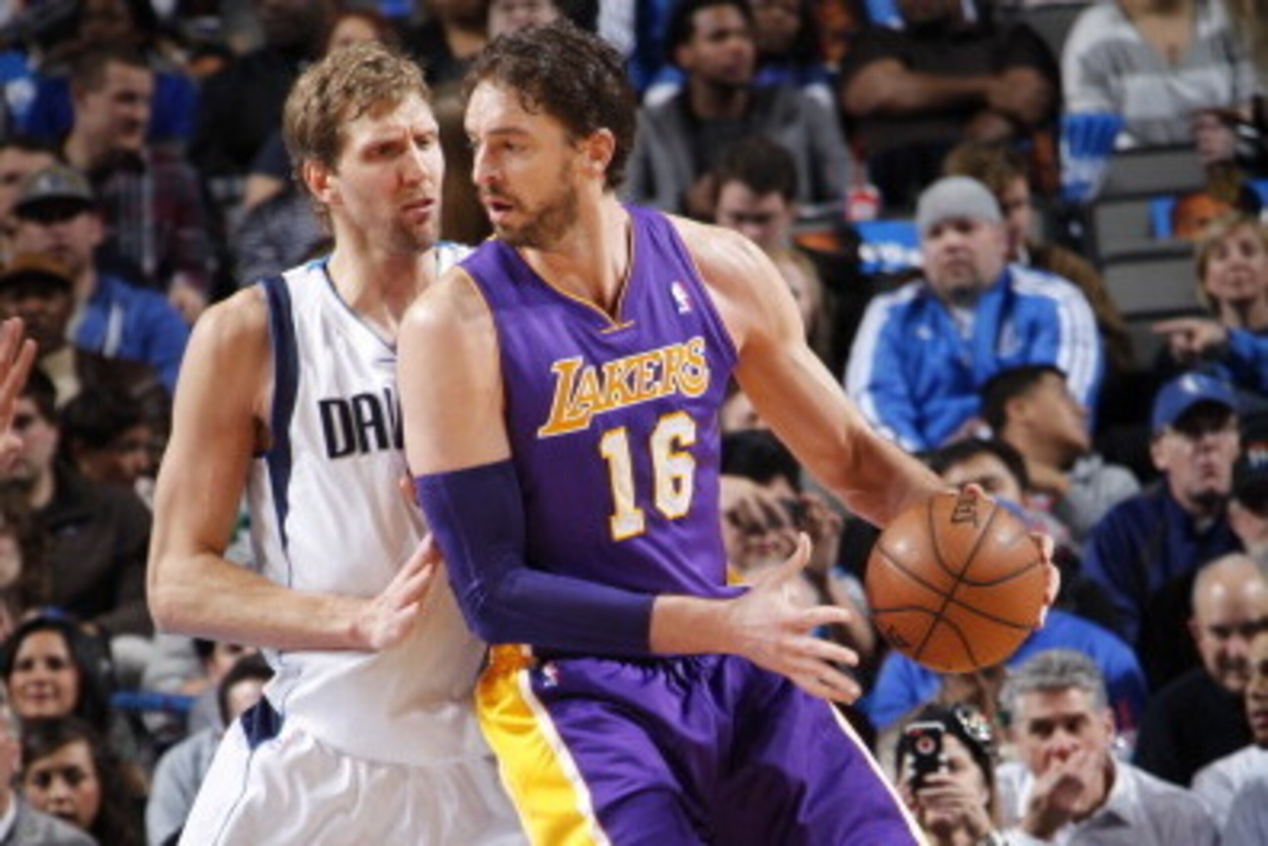 DALLAS, TX - JANUARY 7: Pau Gasol #16 of the Los Angeles Lakers controls the ball against Dirk Nowitzki #41 of the Dallas Mavericks on January 7, 2014 at the American Airlines Center in Dallas, Texas. NOTE TO USER: User expressly acknowledges and agrees t